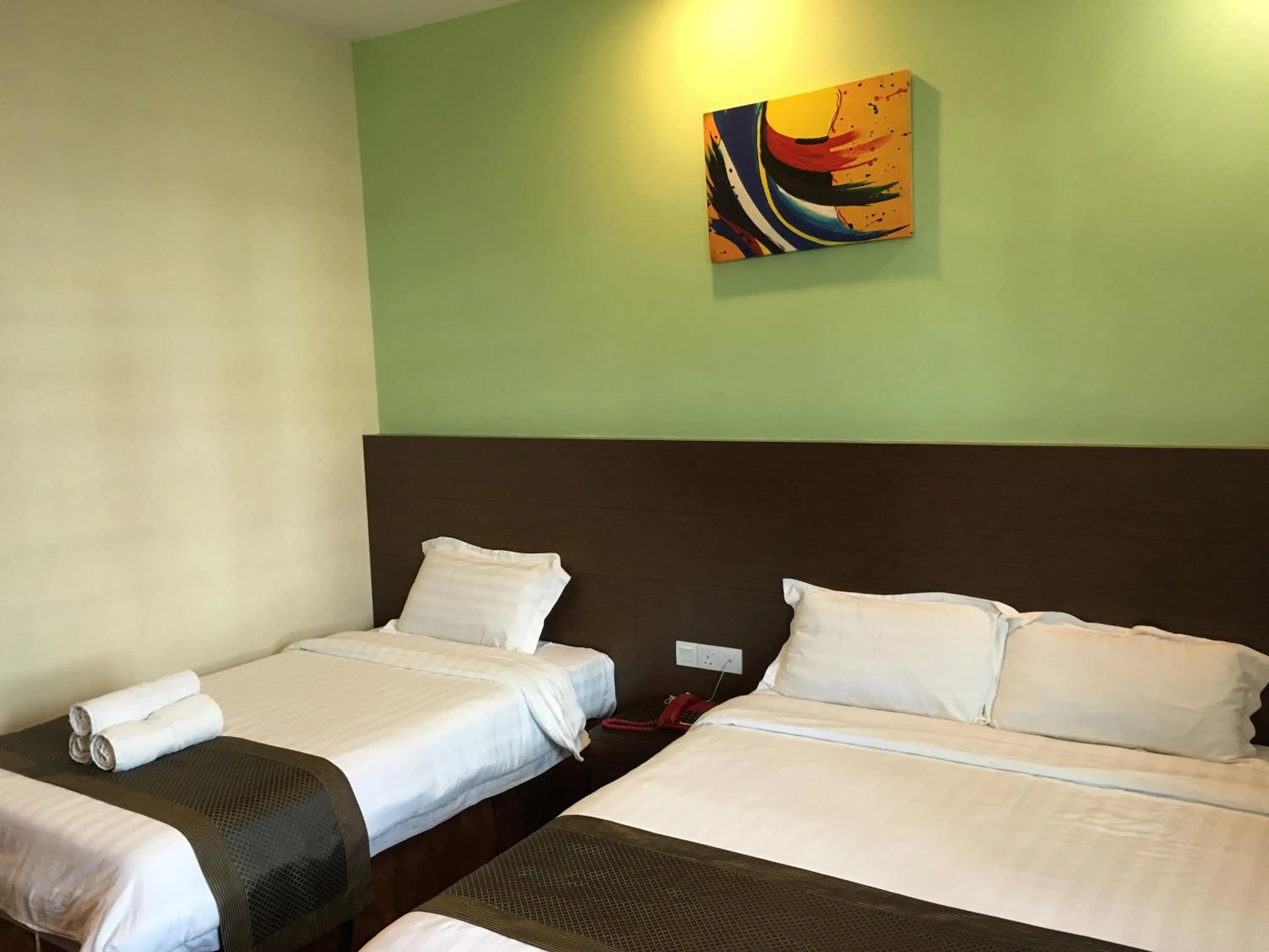 Bed in Lintas Plaza Hotel