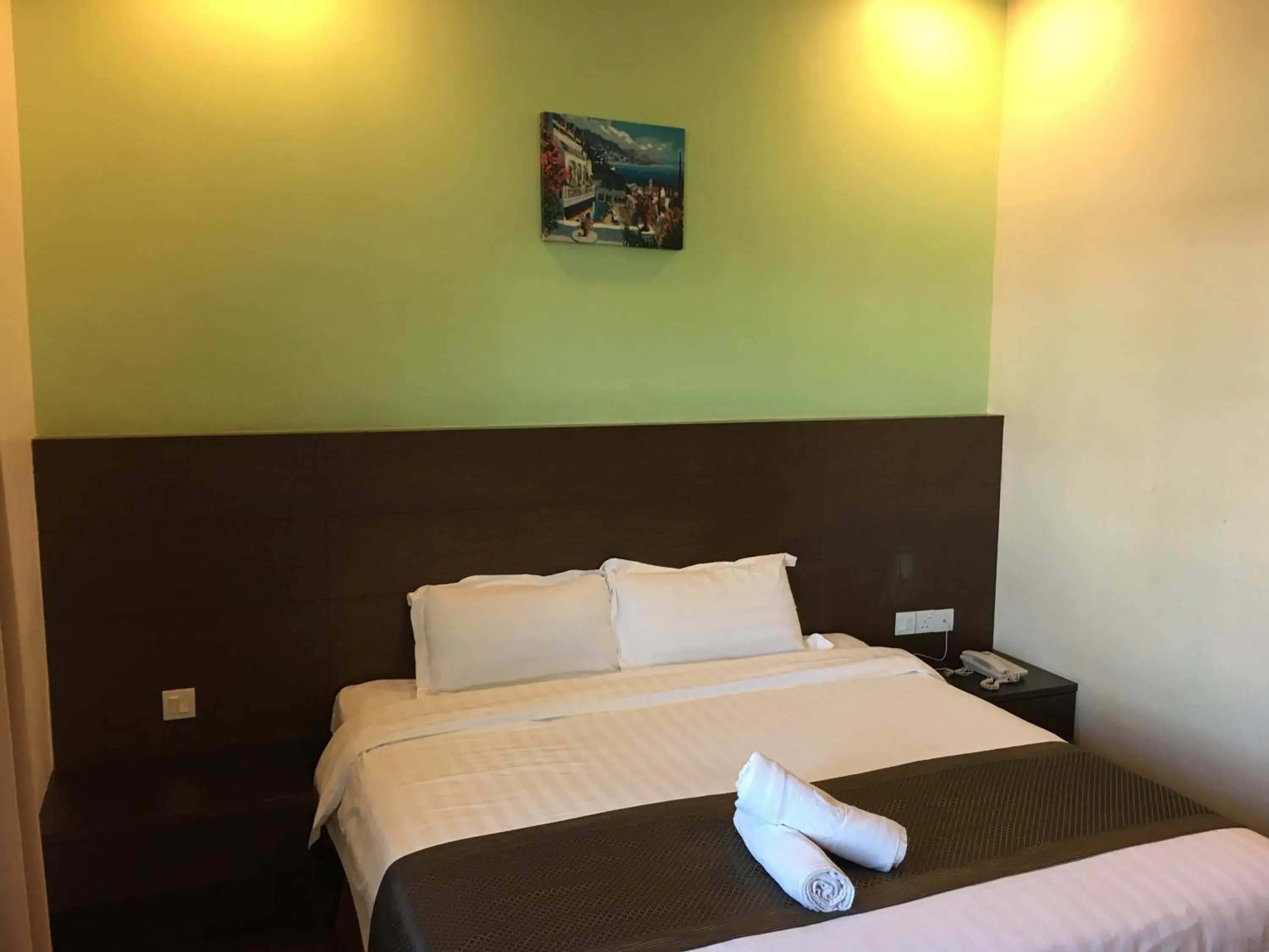 Bed in Lintas Plaza Boutique Hotel