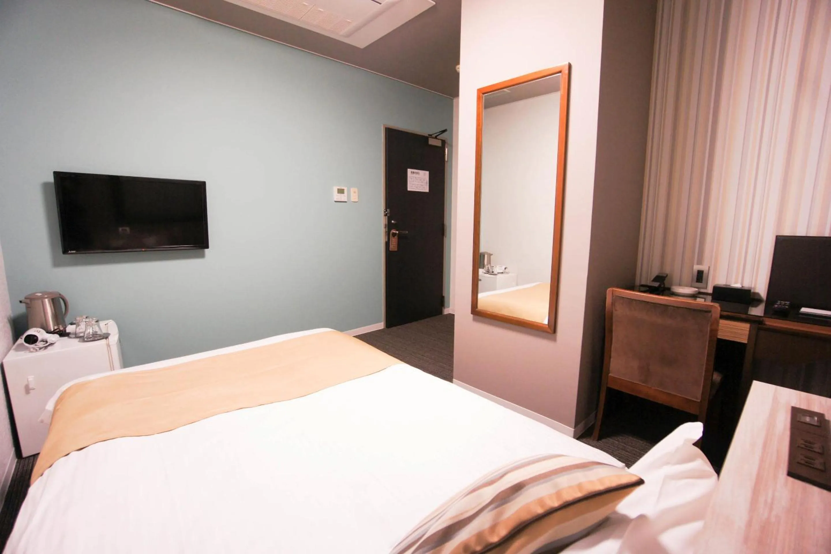 Bed in Hotel AreaOne Nobeoka