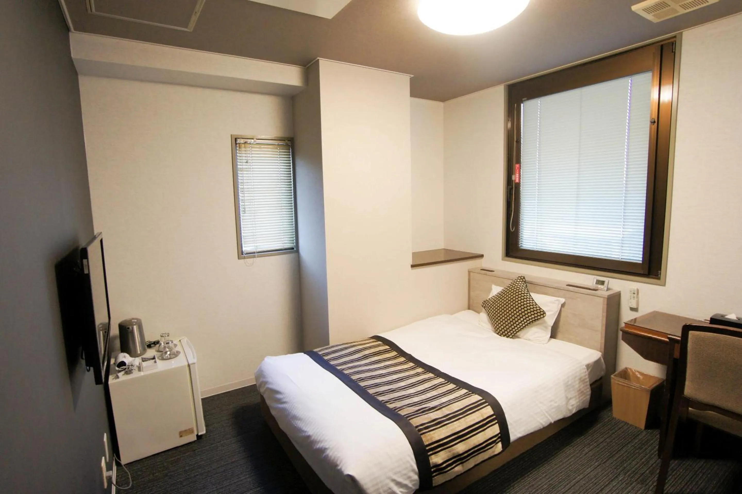 Bed in Hotel AreaOne Nobeoka