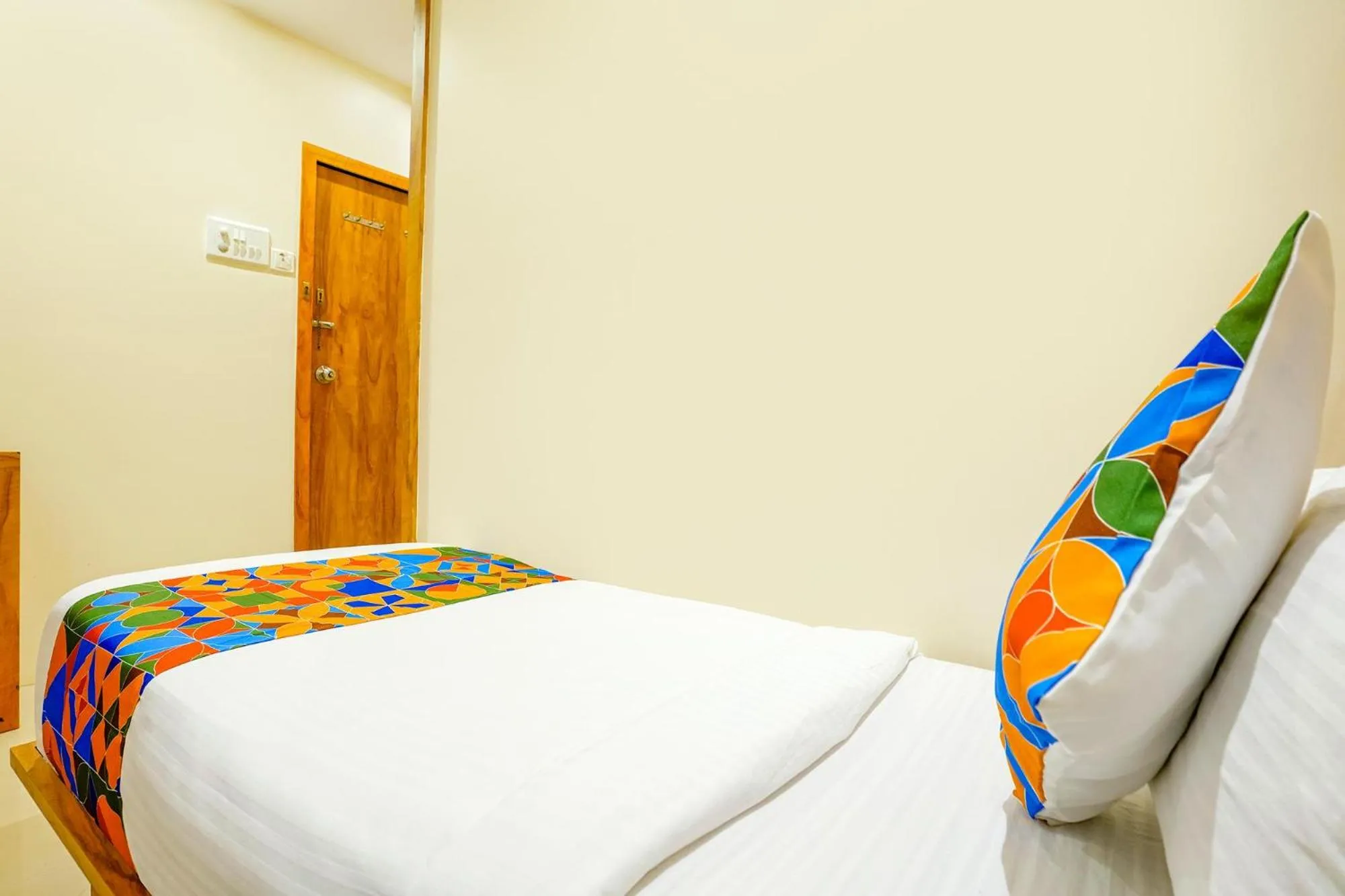 Bed in FabHotel Indore Palace