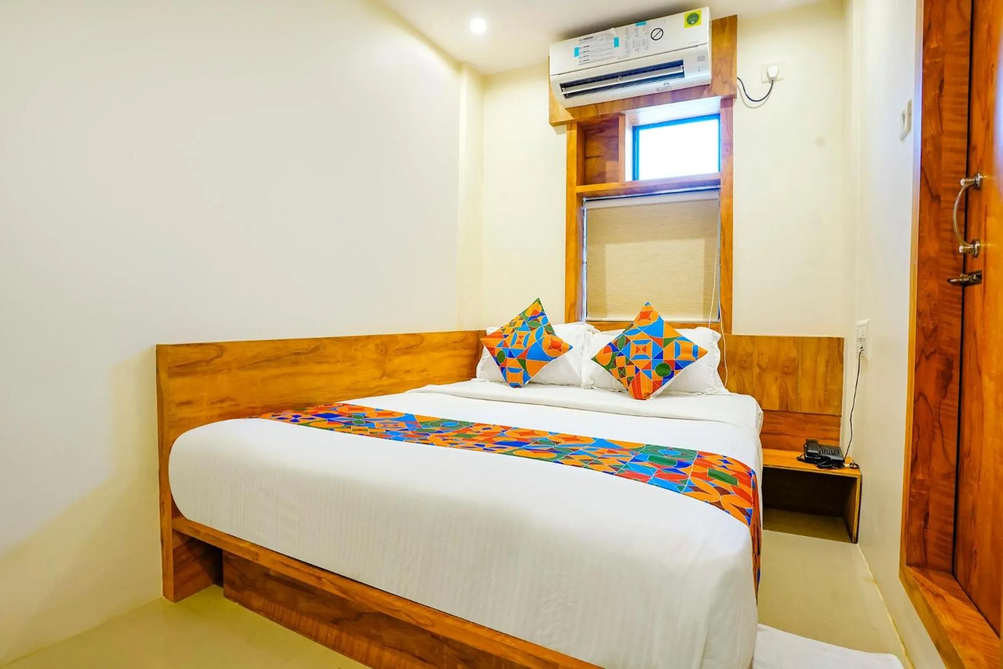 Bed in FabHotel Indore Palace