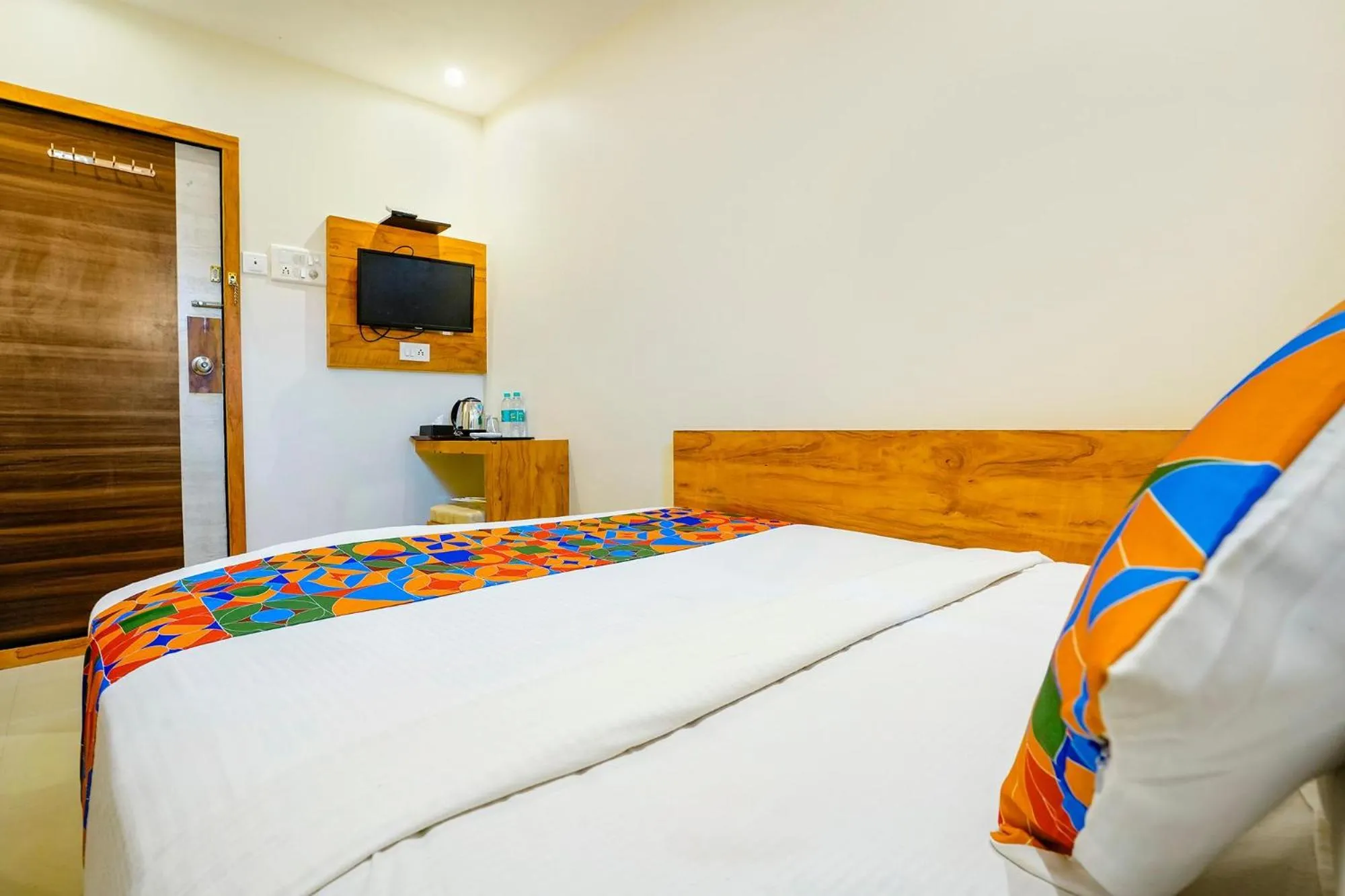 Bed in FabHotel Indore Palace