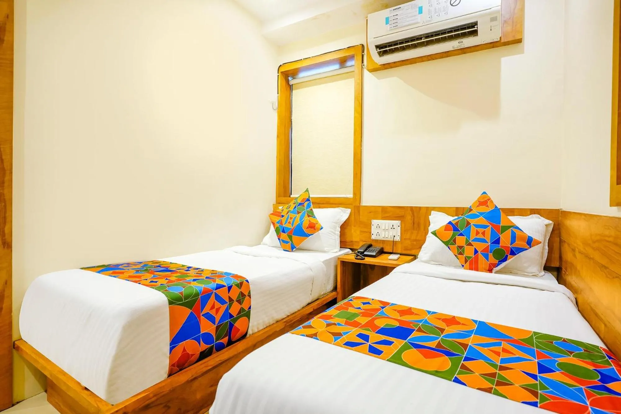 Bed in FabHotel Indore Palace