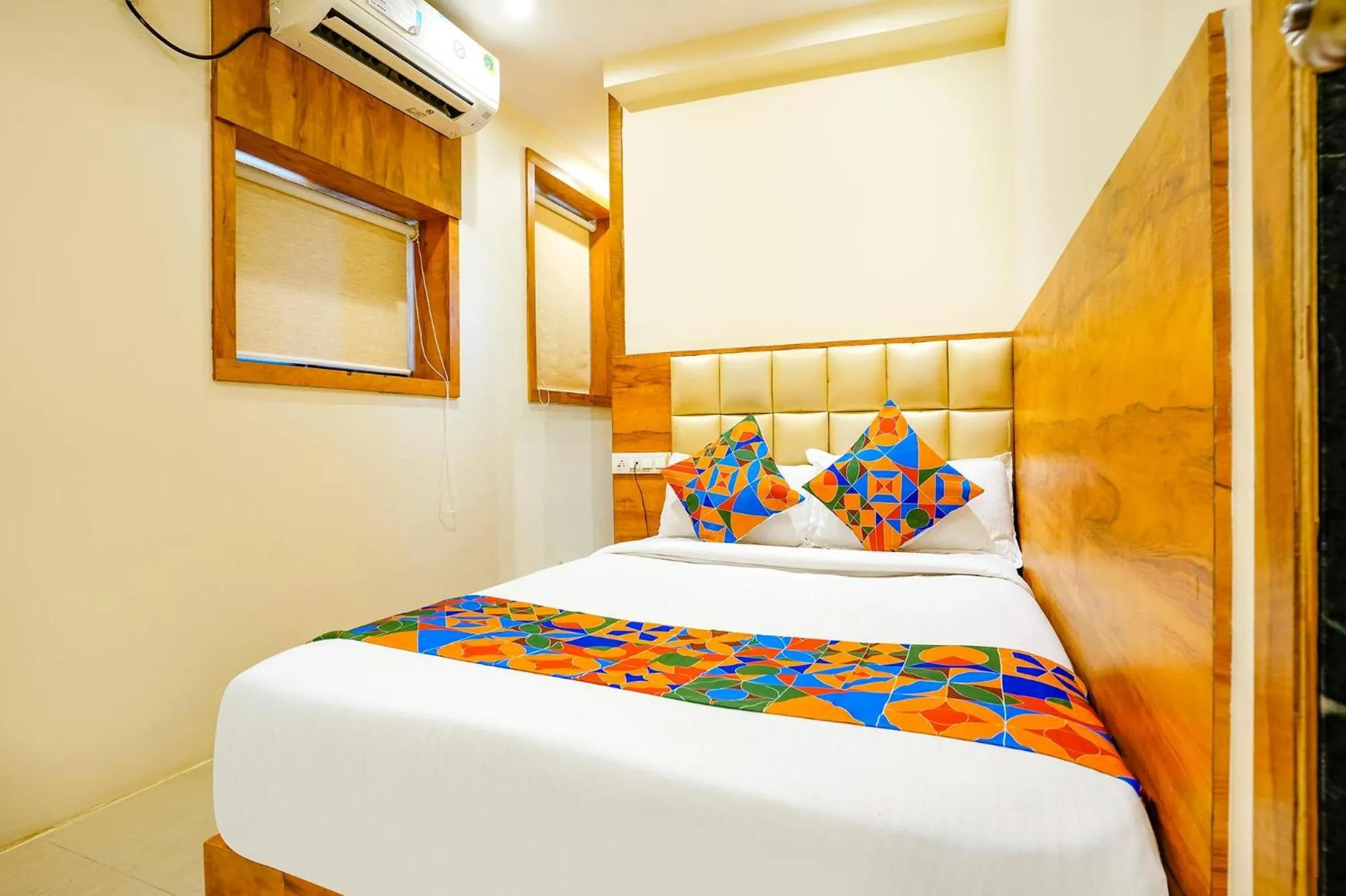 Bed in FabHotel Indore Palace