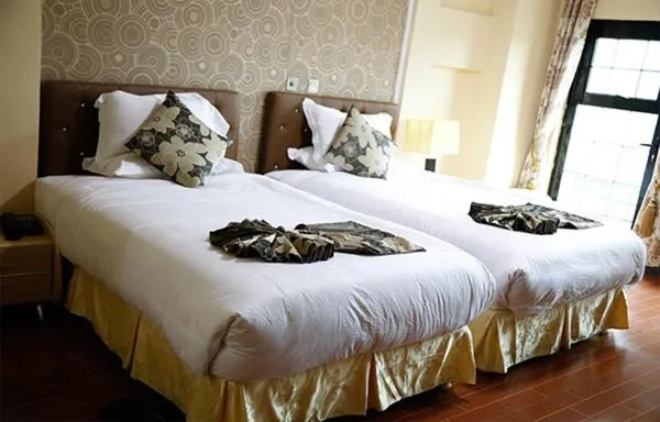 Bed in Afropolitan Hotel