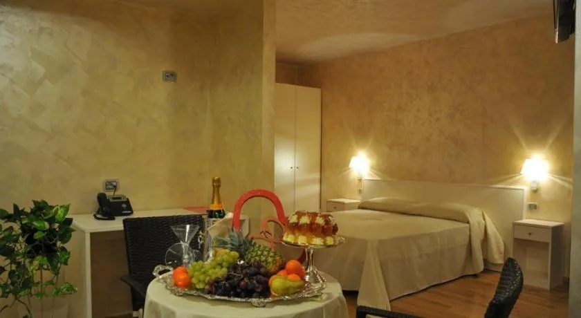 Seating area, Bed in I Rocchi Hotel