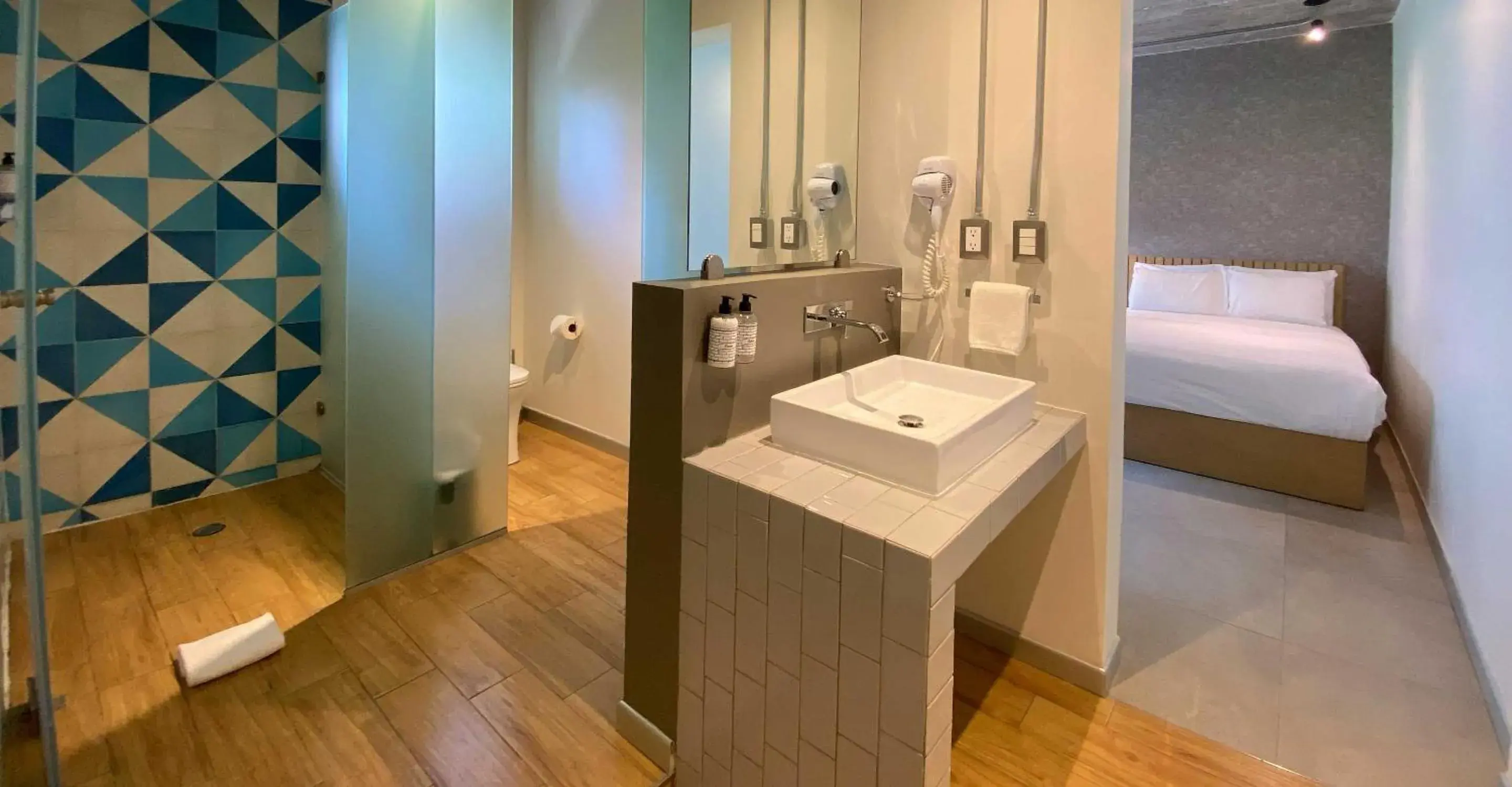 Bathroom, Bed in The Host Business Suites at WTC Bathroom, Bed in The Host Business Suites at WTC