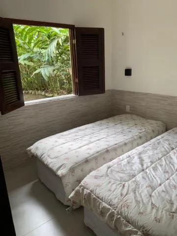 Bed in Pousada Chale Cana Brava