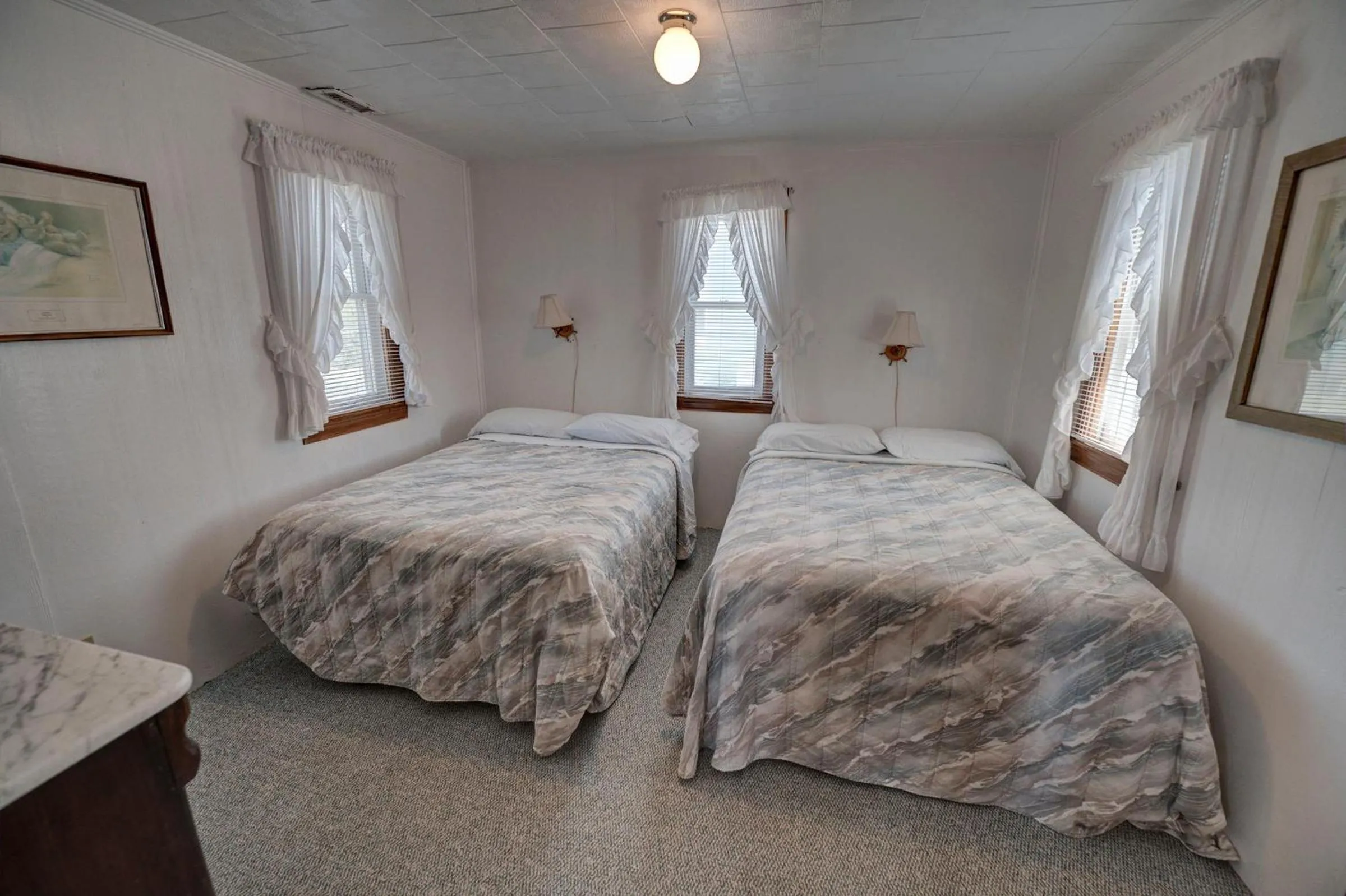 Bed in Outer Banks Motel - Village Accommodations