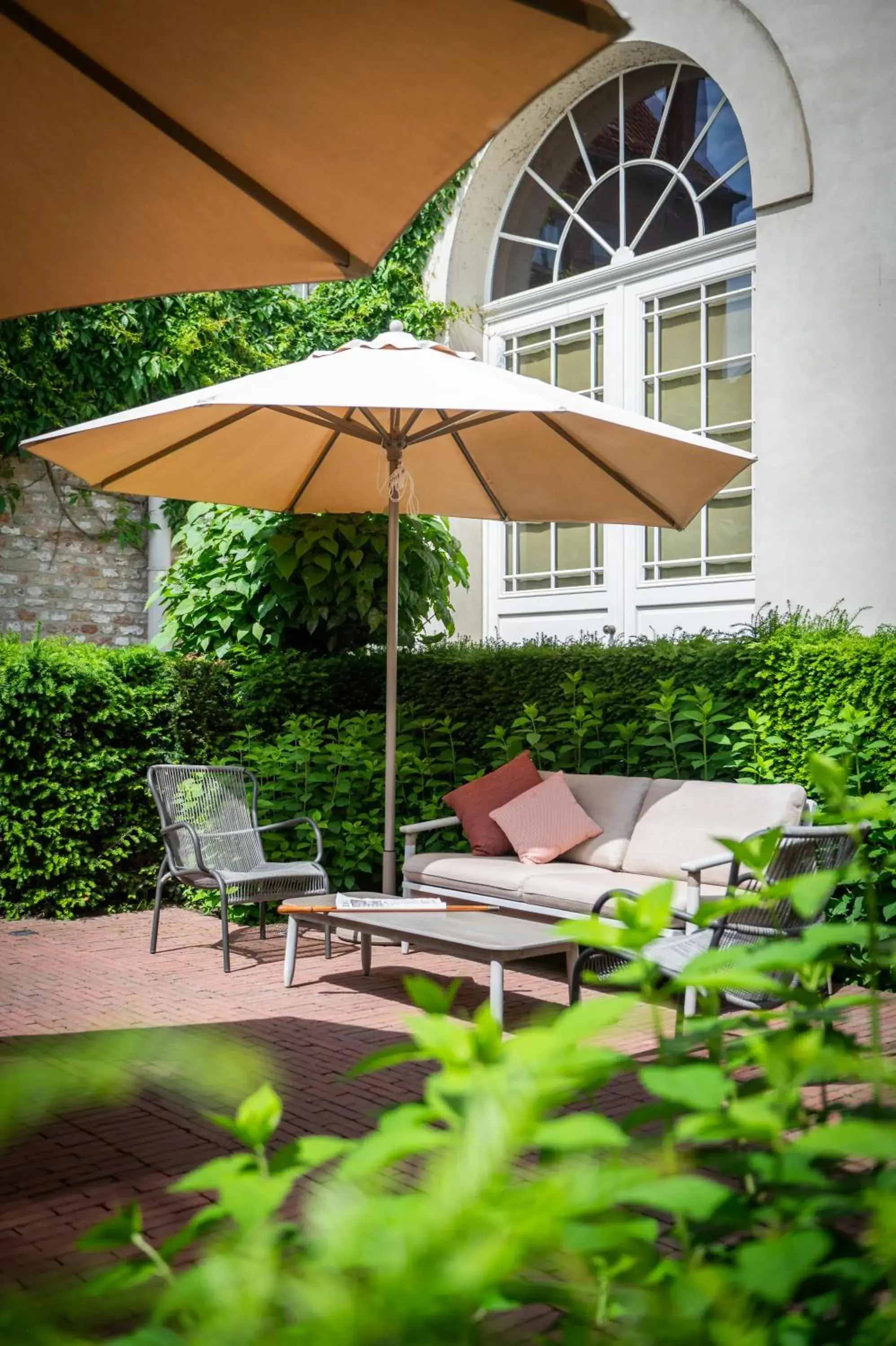 Inner courtyard view in Dukes' Arches Brugge - by Dukes' Hotel Collection Inner courtyard view in Dukes' Arches Brugge - by Dukes' Hotel Collection