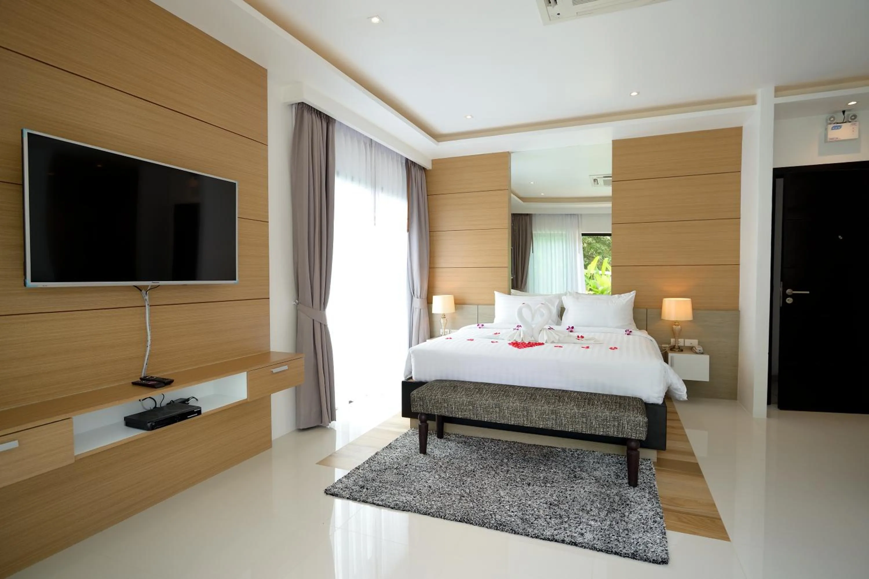 Kitchen or kitchenette, Bed in Pumeria Resort Phuket - SHA Plus