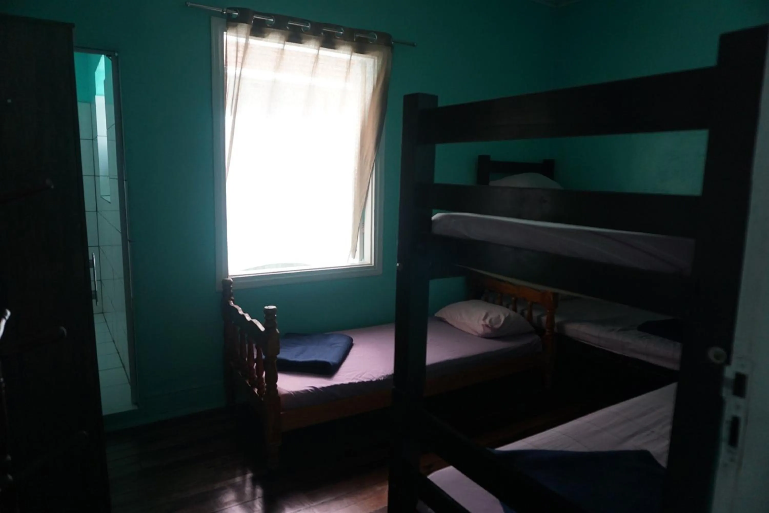 Bed in Pousada Orquidário