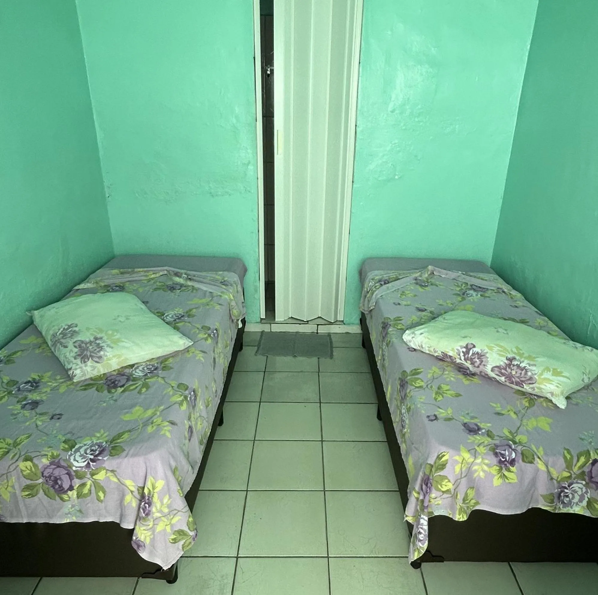 Bed in Pousada Orquidário