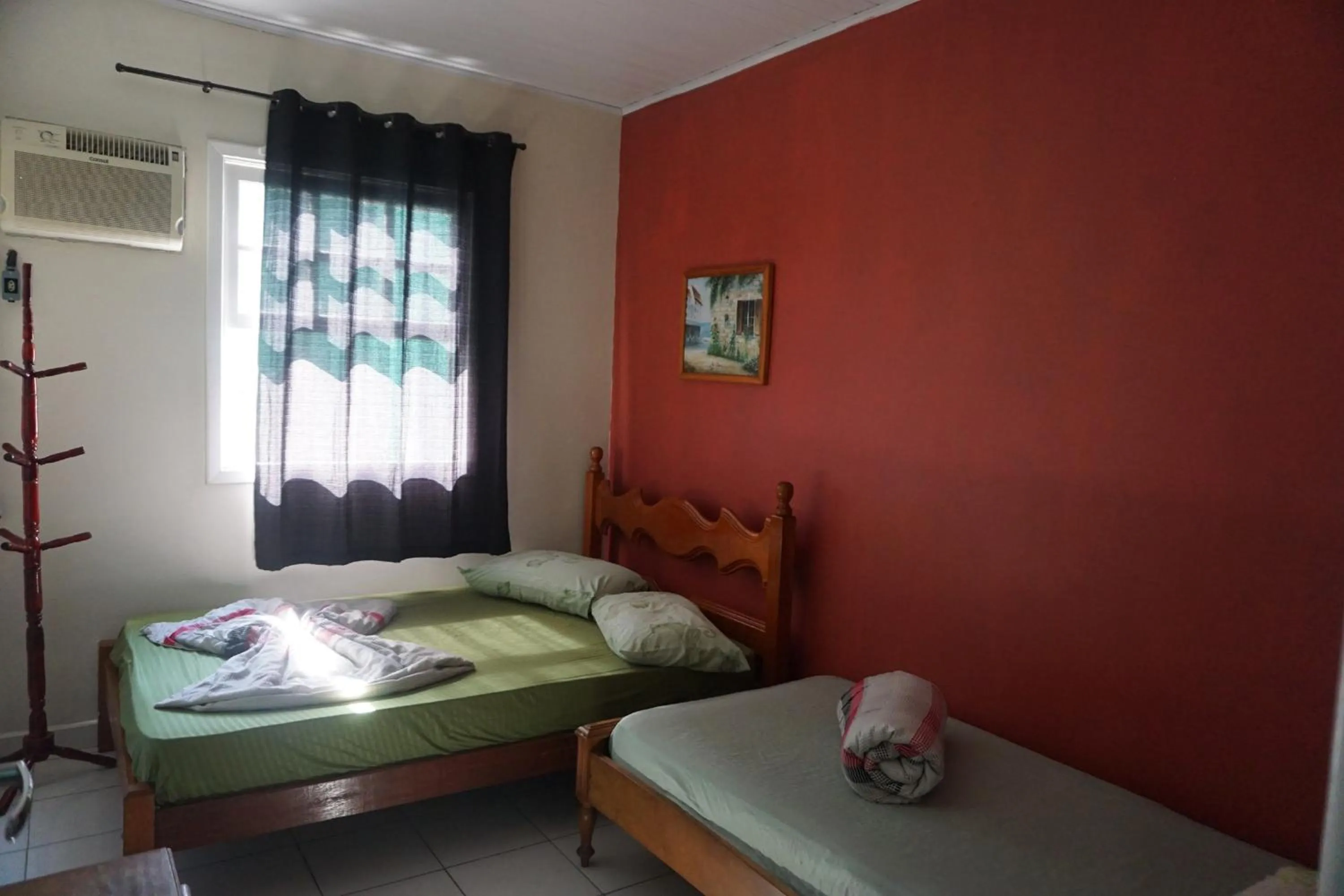 Bed in Pousada Orquidário