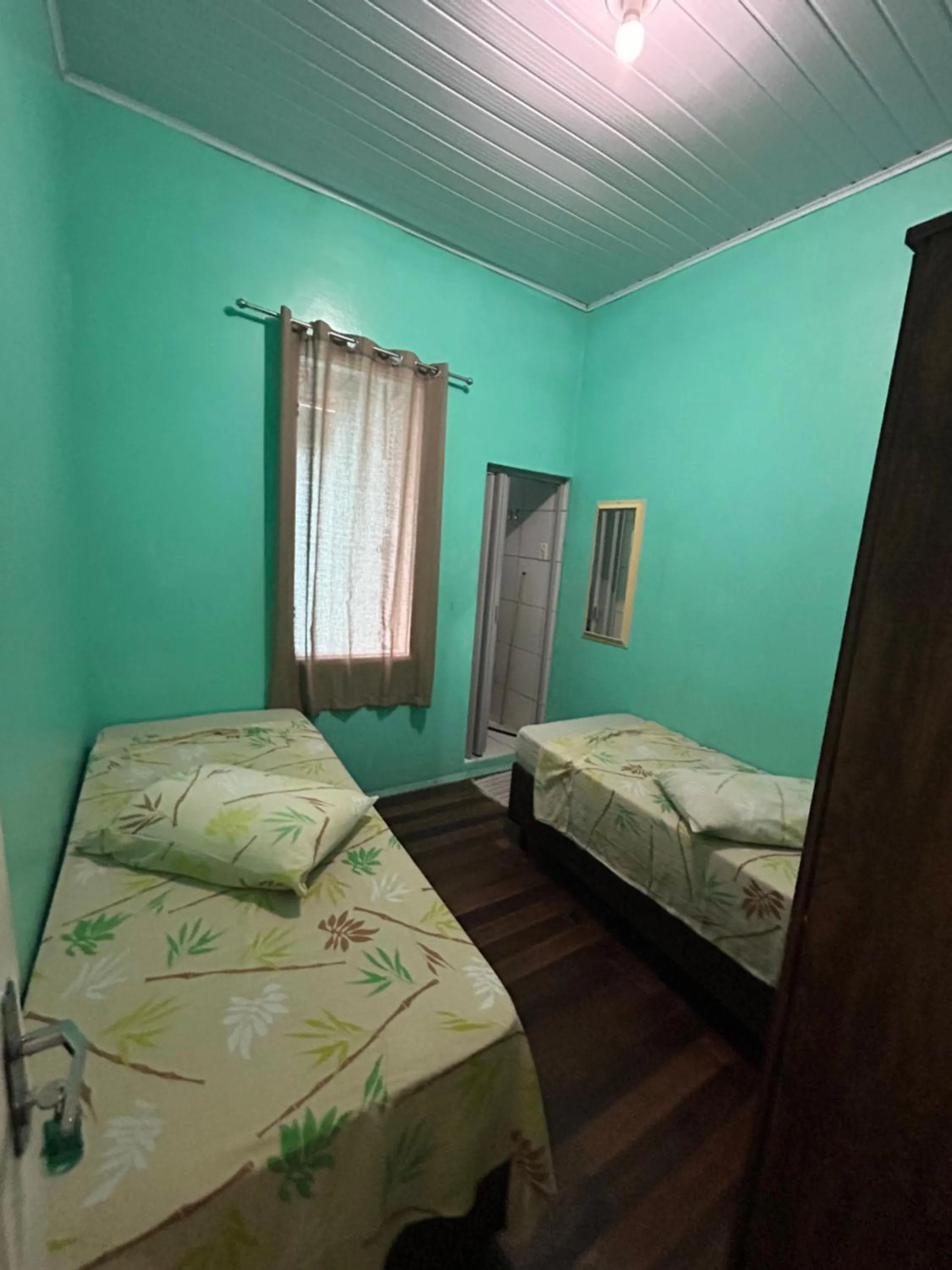 Bed in Pousada Orquidário