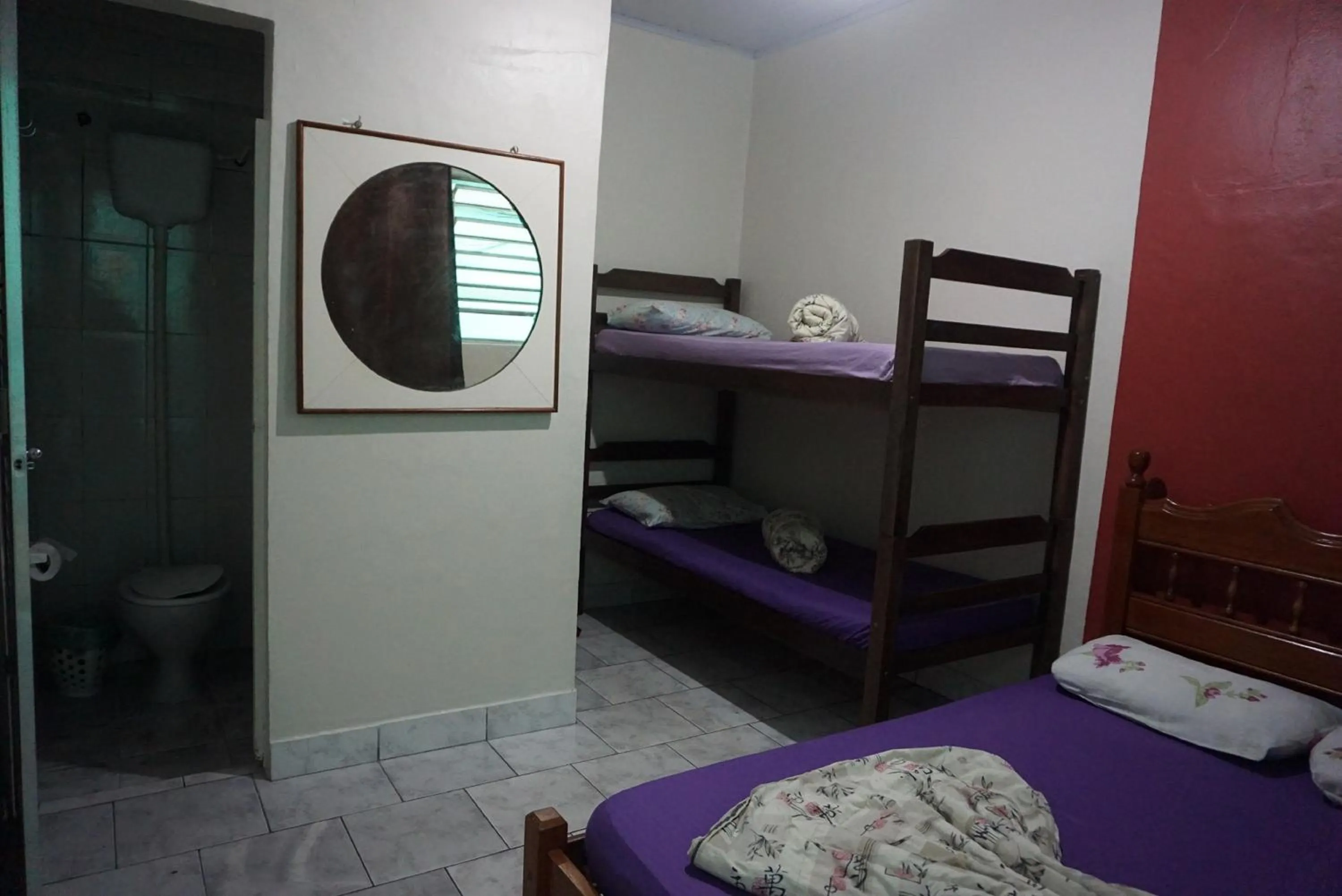 Bed in Pousada Orquidário