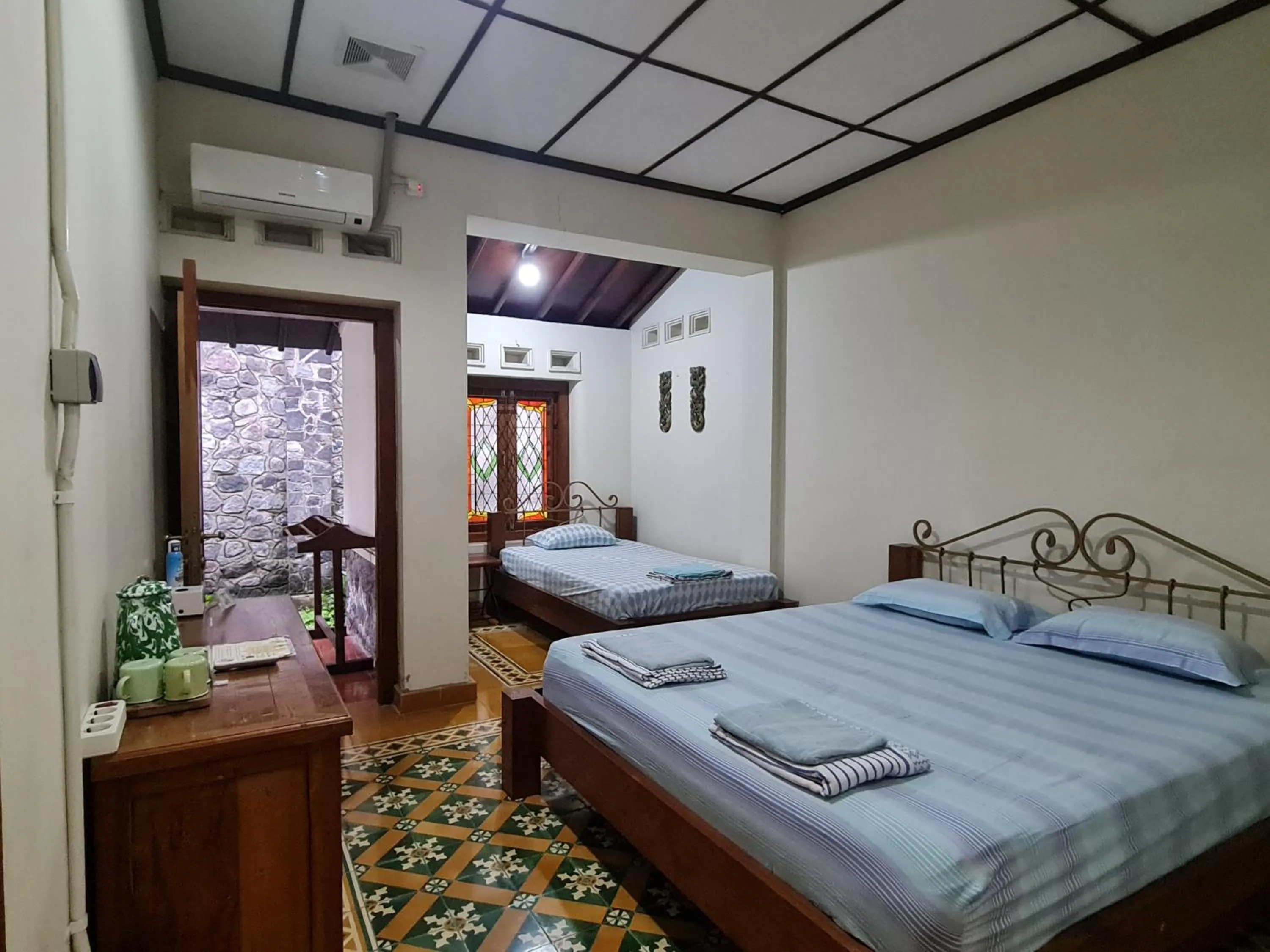 Bed in Omah Pitoe Yogya Homestay