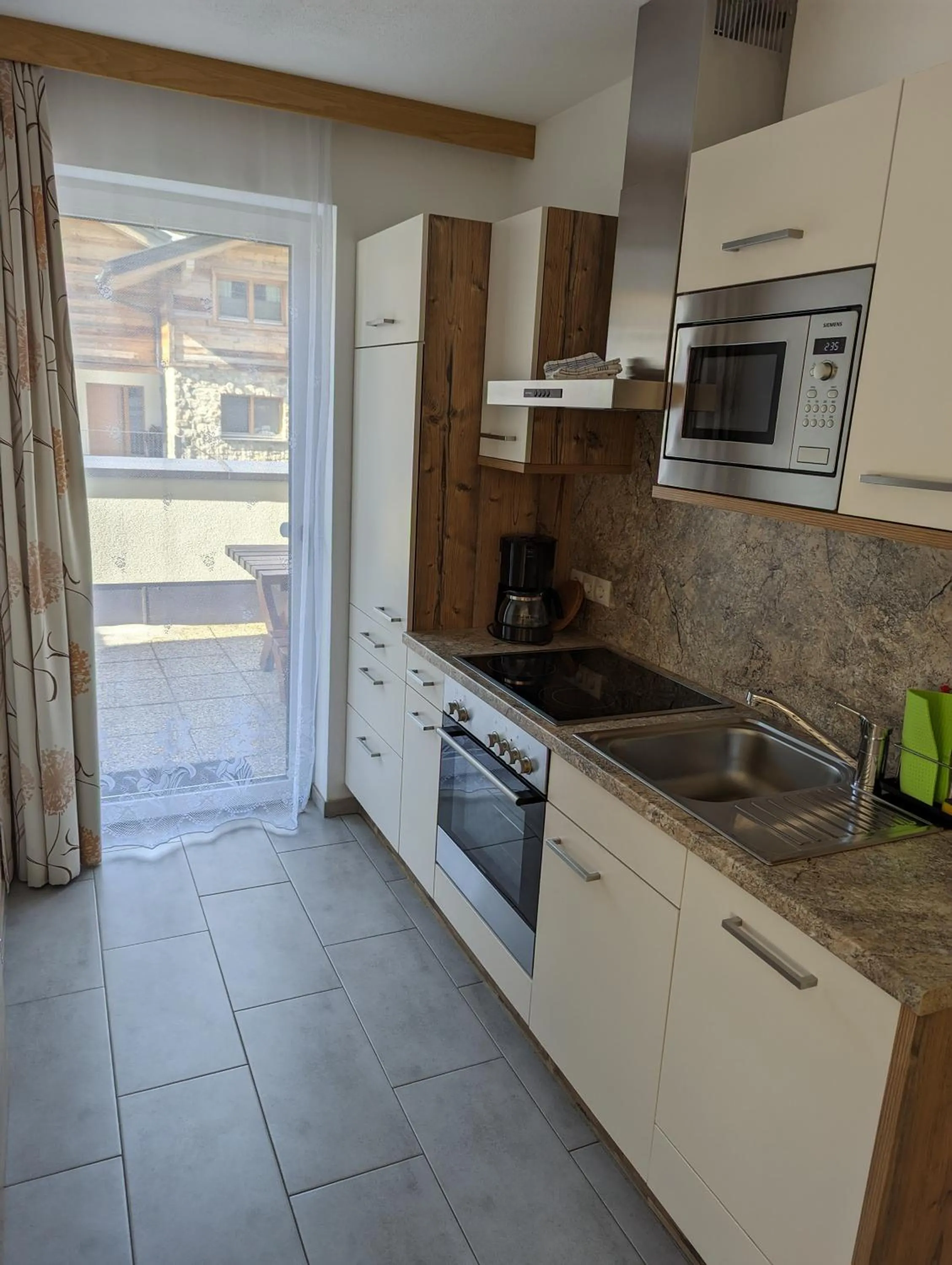 Kitchen or kitchenette in Appartements Gotthardt