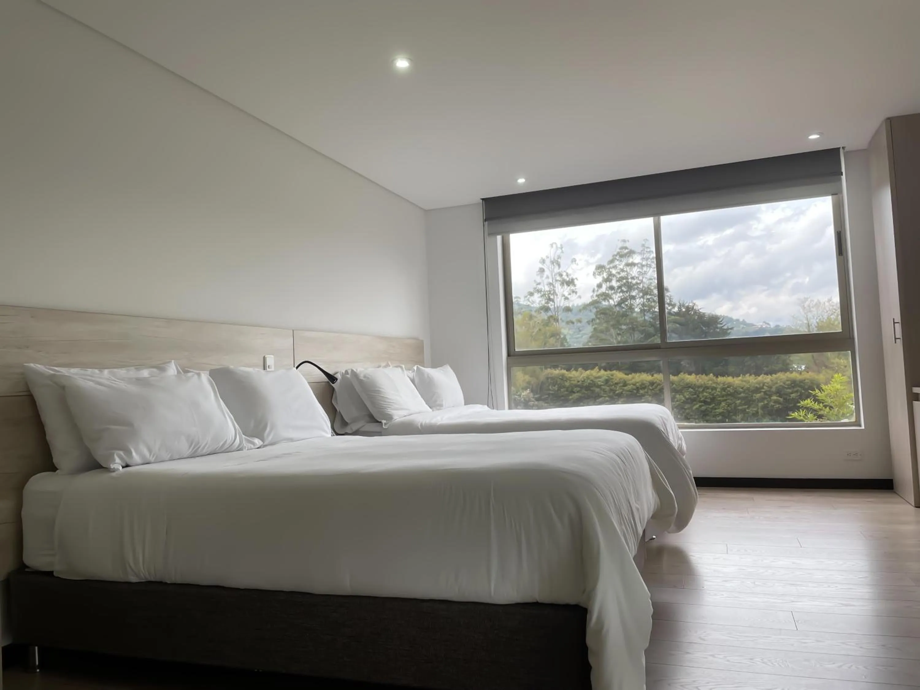 Bed in MG Hotels & Suites