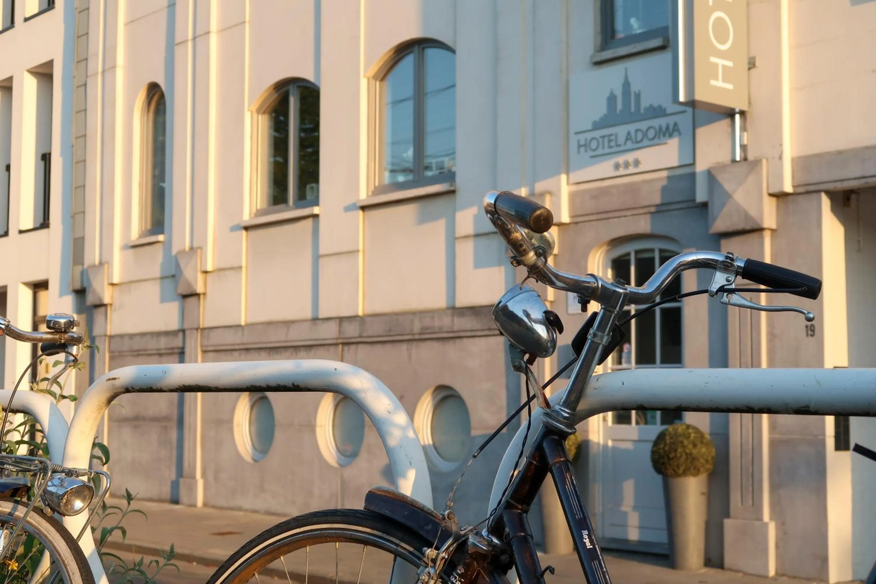 Property logo or sign in Hotel Adoma