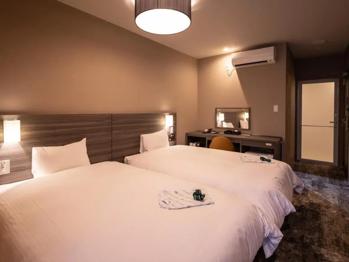 Photo of the whole room, Bed in Central Hotel Takeoonsen Ekimae Photo of the whole room, Bed in Central Hotel Takeoonsen Ekimae