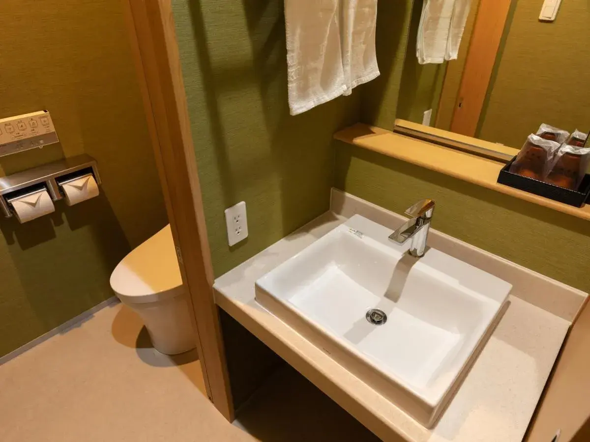 Bathroom in Central Hotel Takeoonsen Ekimae Bathroom in Central Hotel Takeoonsen Ekimae