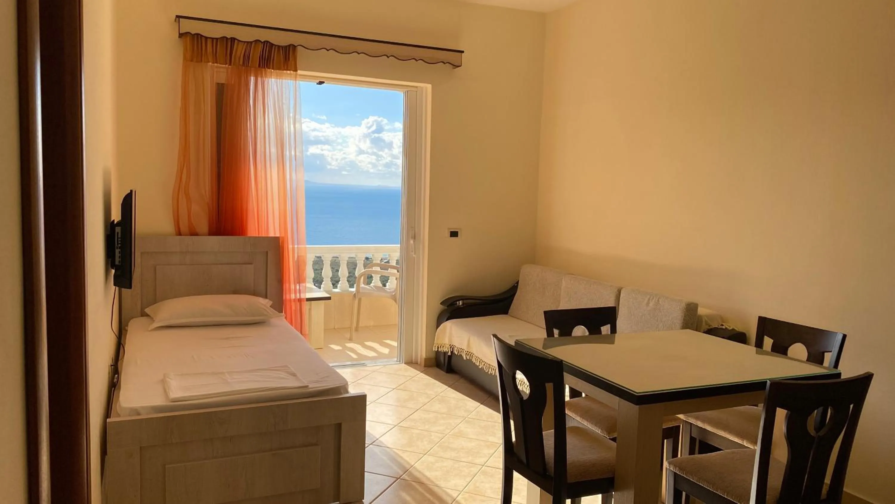 Dining area, Bed in OniRana Apartments