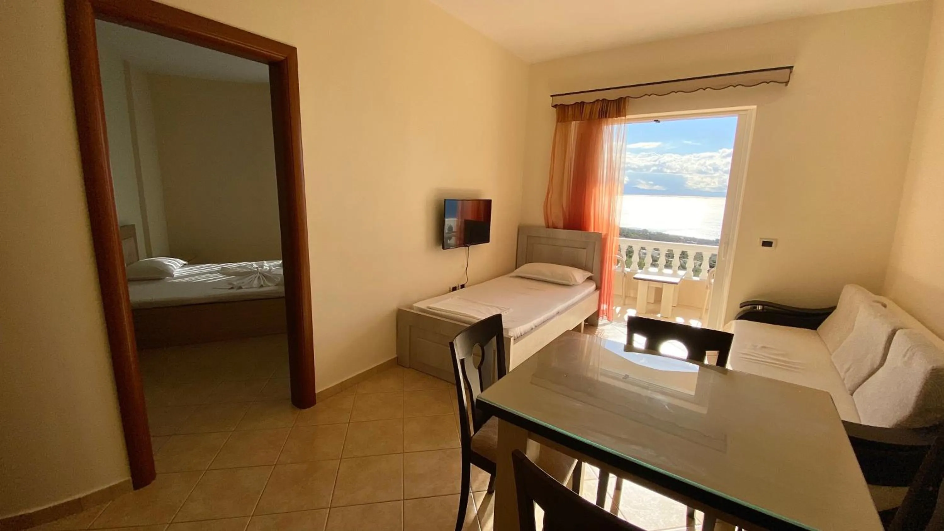 Dining area, Bed in OniRana Apartments