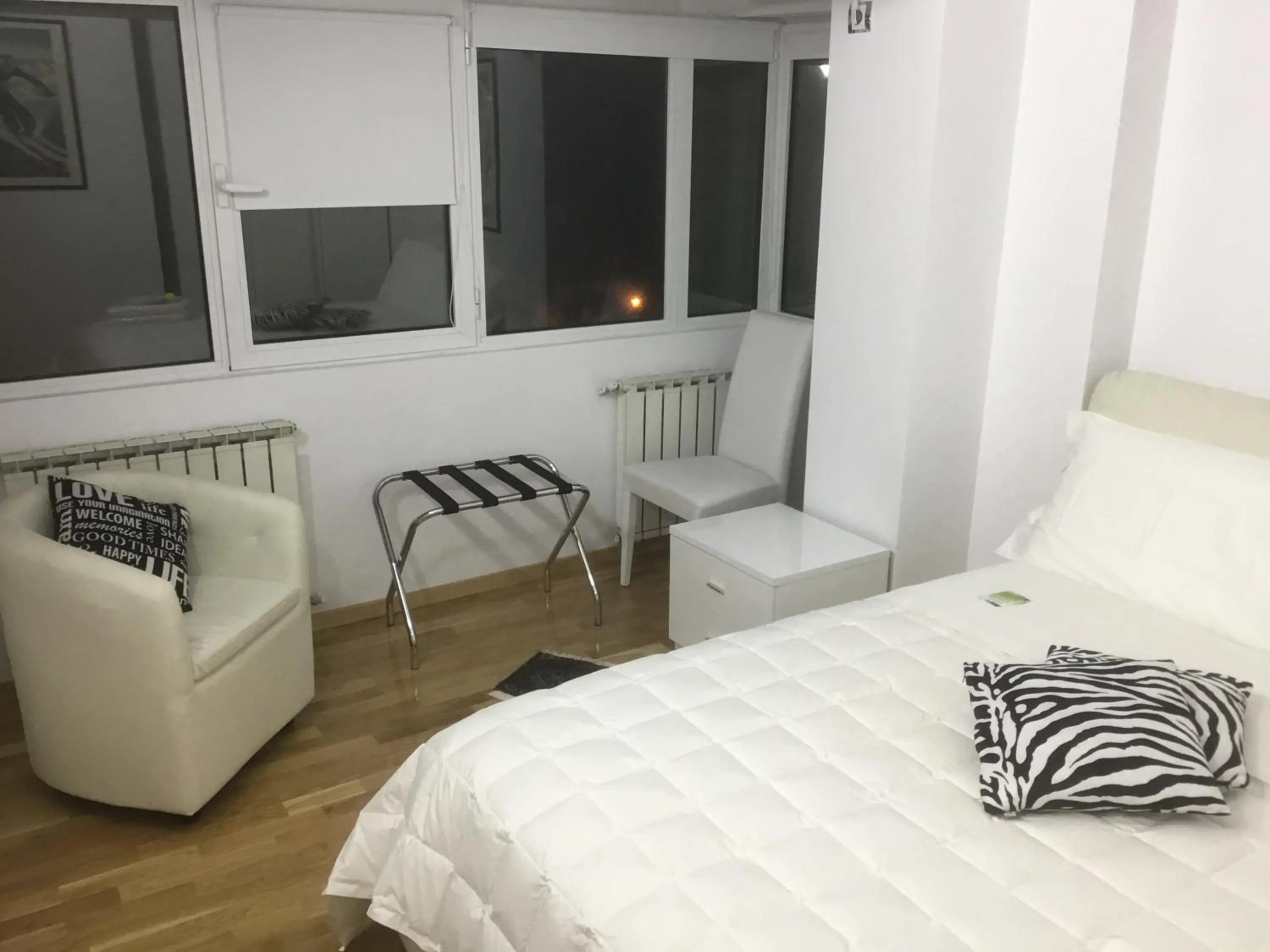 Bed in White Dream Suites