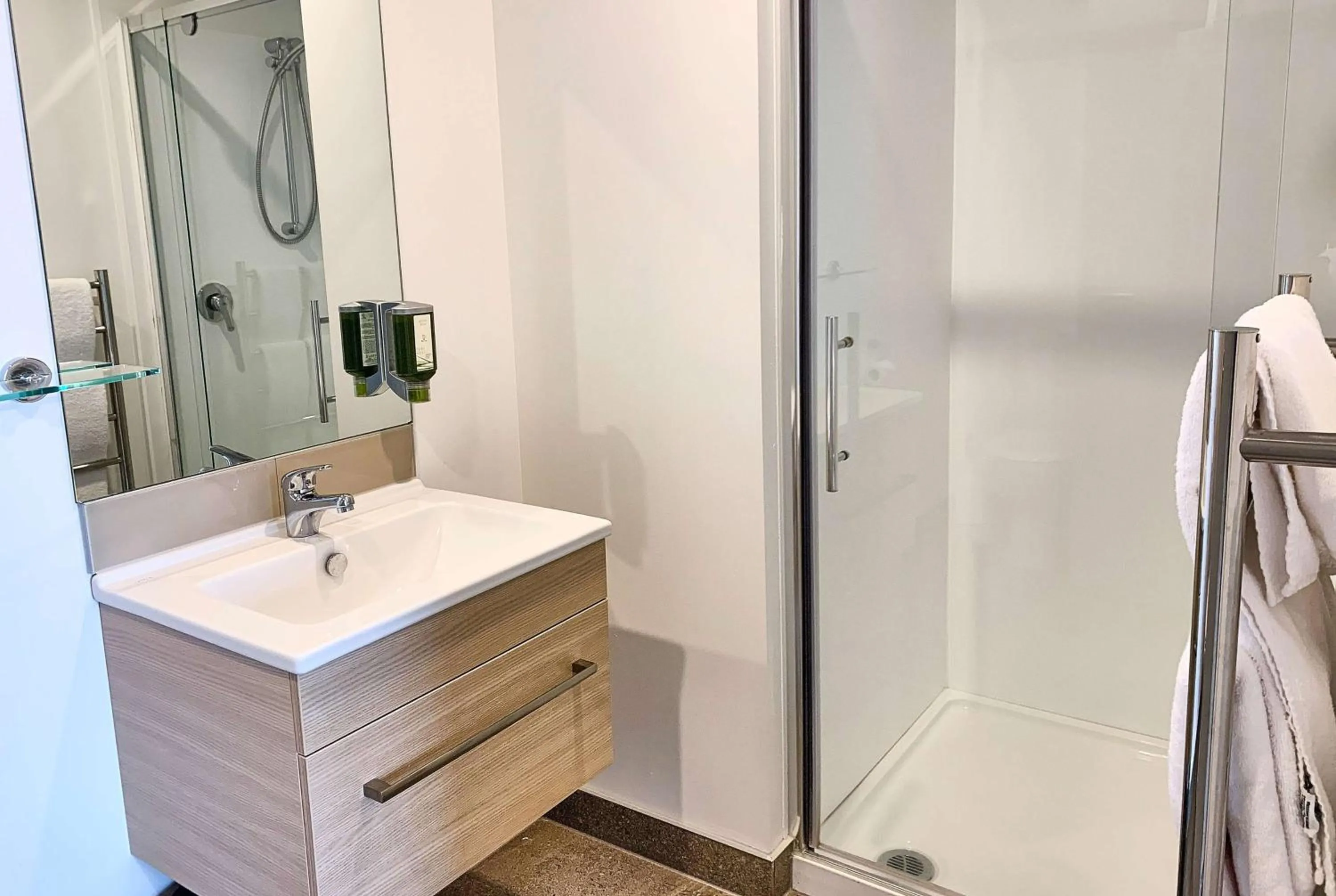 Bathroom in Ramada Suites by Wyndham Albany