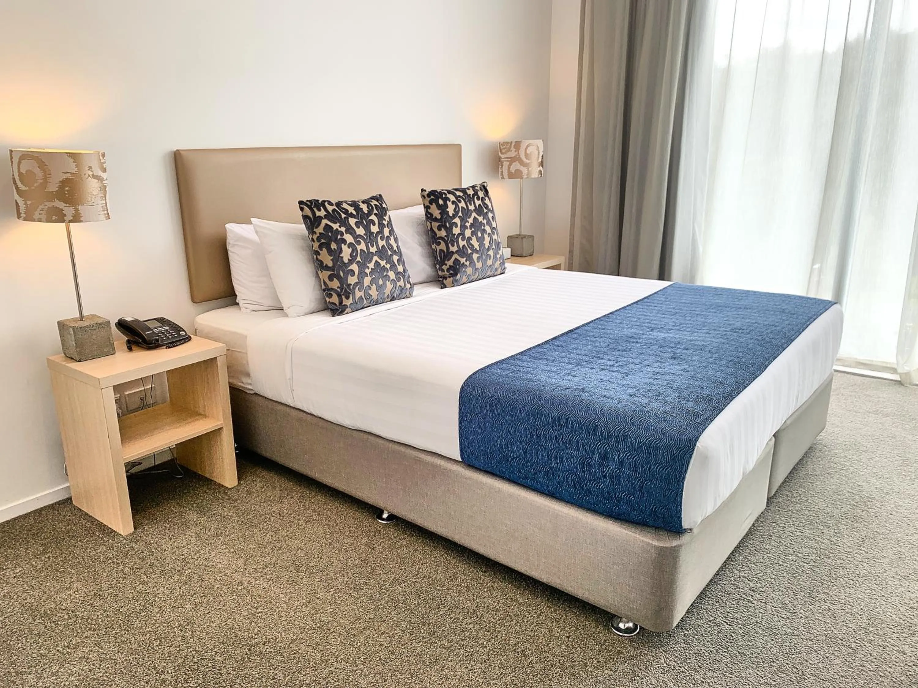 Bed in Ramada Suites by Wyndham Albany