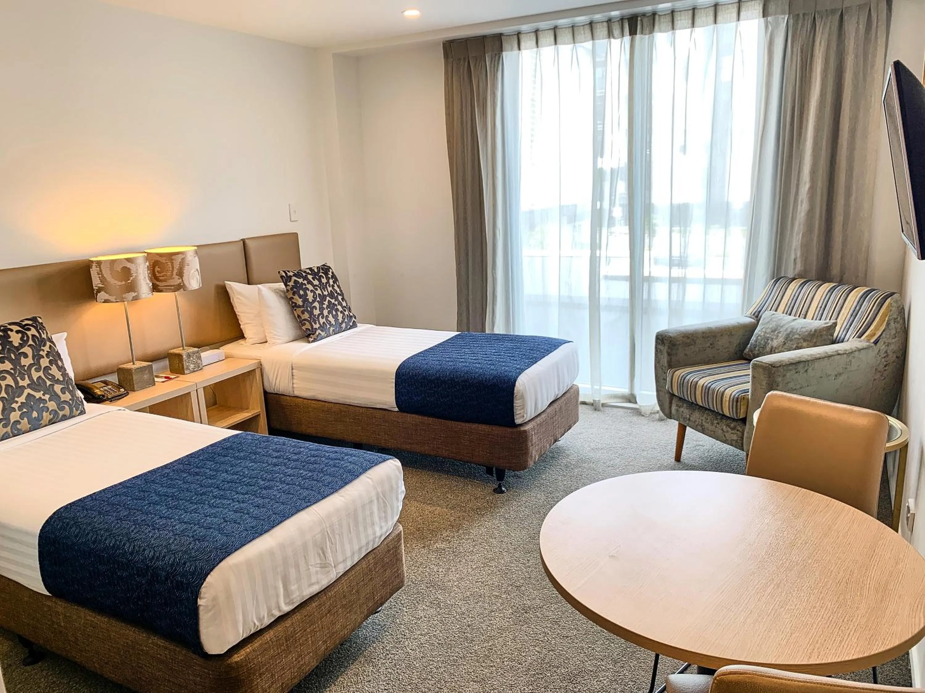 Bed in Ramada Suites by Wyndham Albany