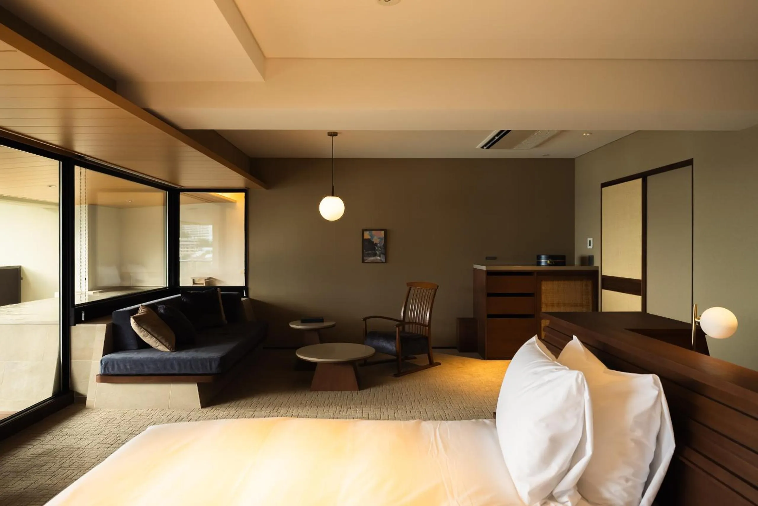 Bed in IZU RETREAT by Onko Chishin