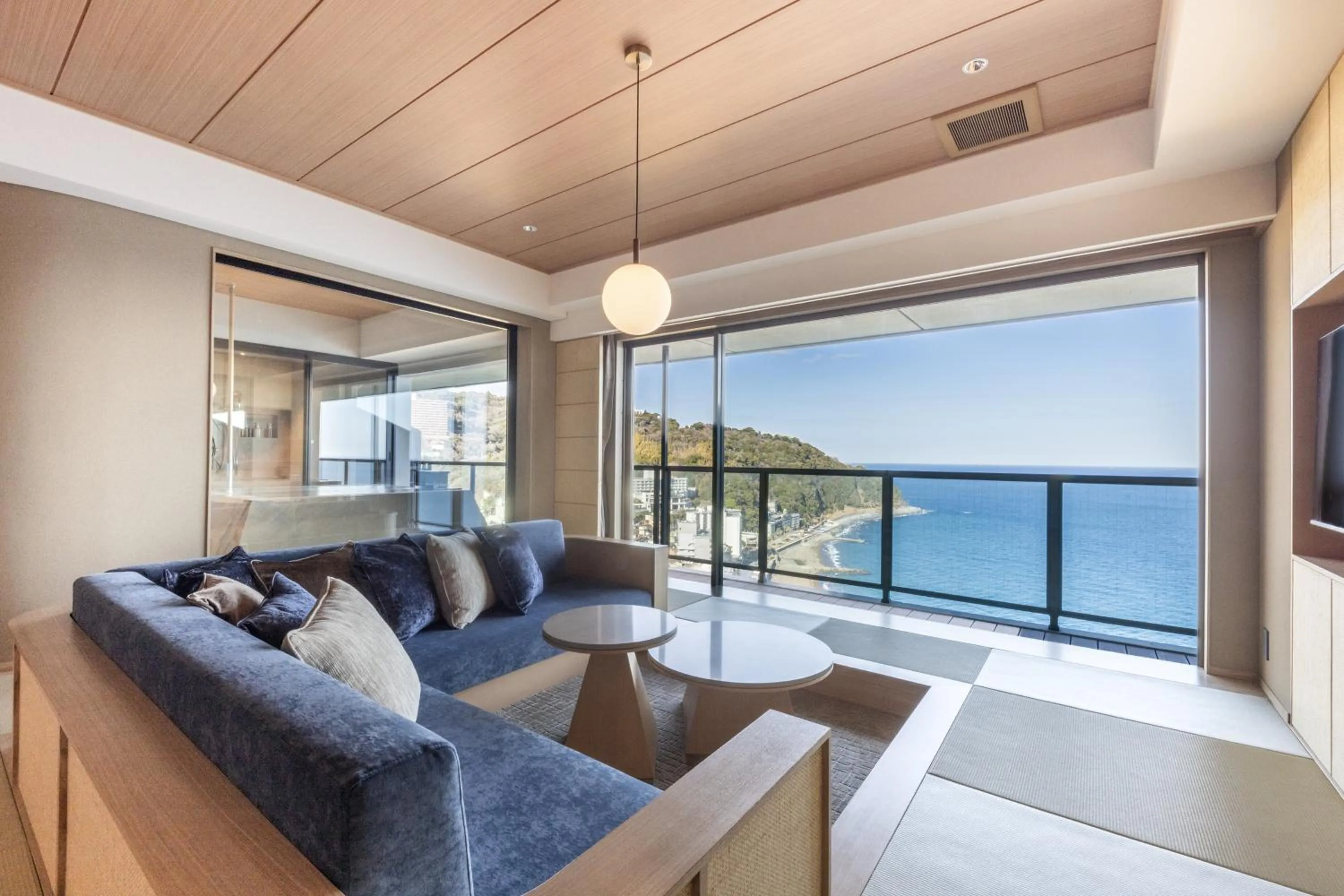Seating area in IZU RETREAT by Onko Chishin
