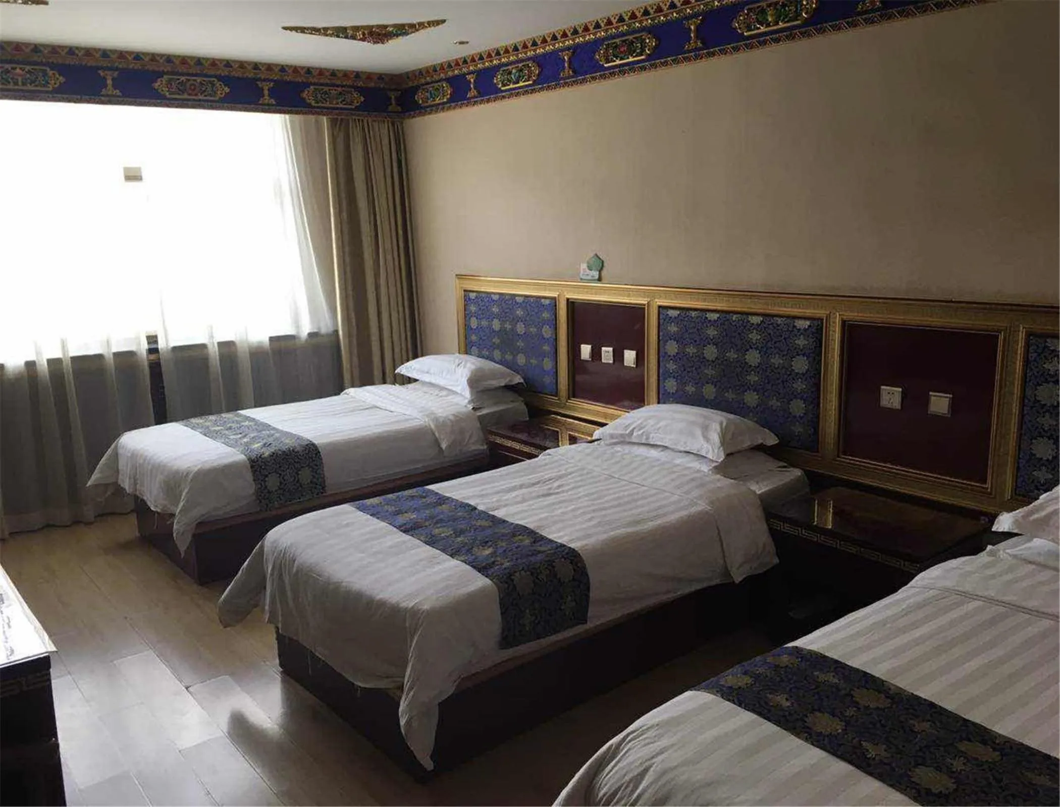 Bed in Overseas Tibetan Hotel