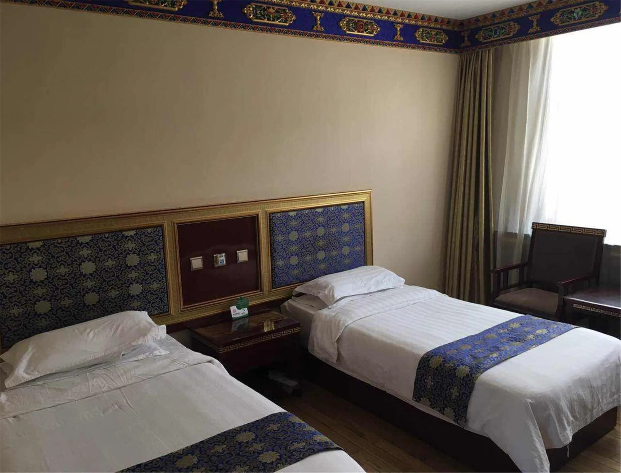 Bed in Overseas Tibetan Hotel