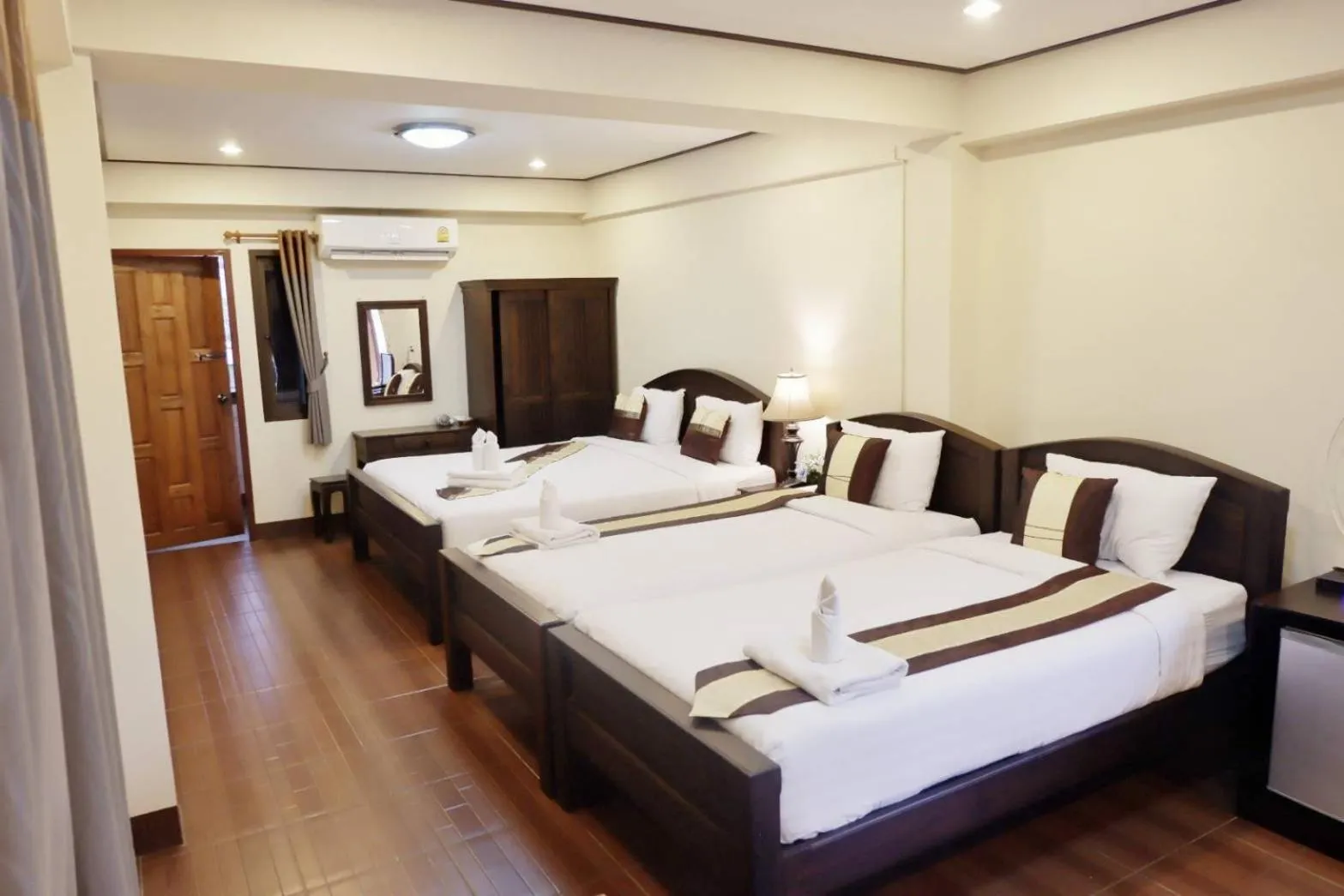 Bed in NanBaanKhun Hotel