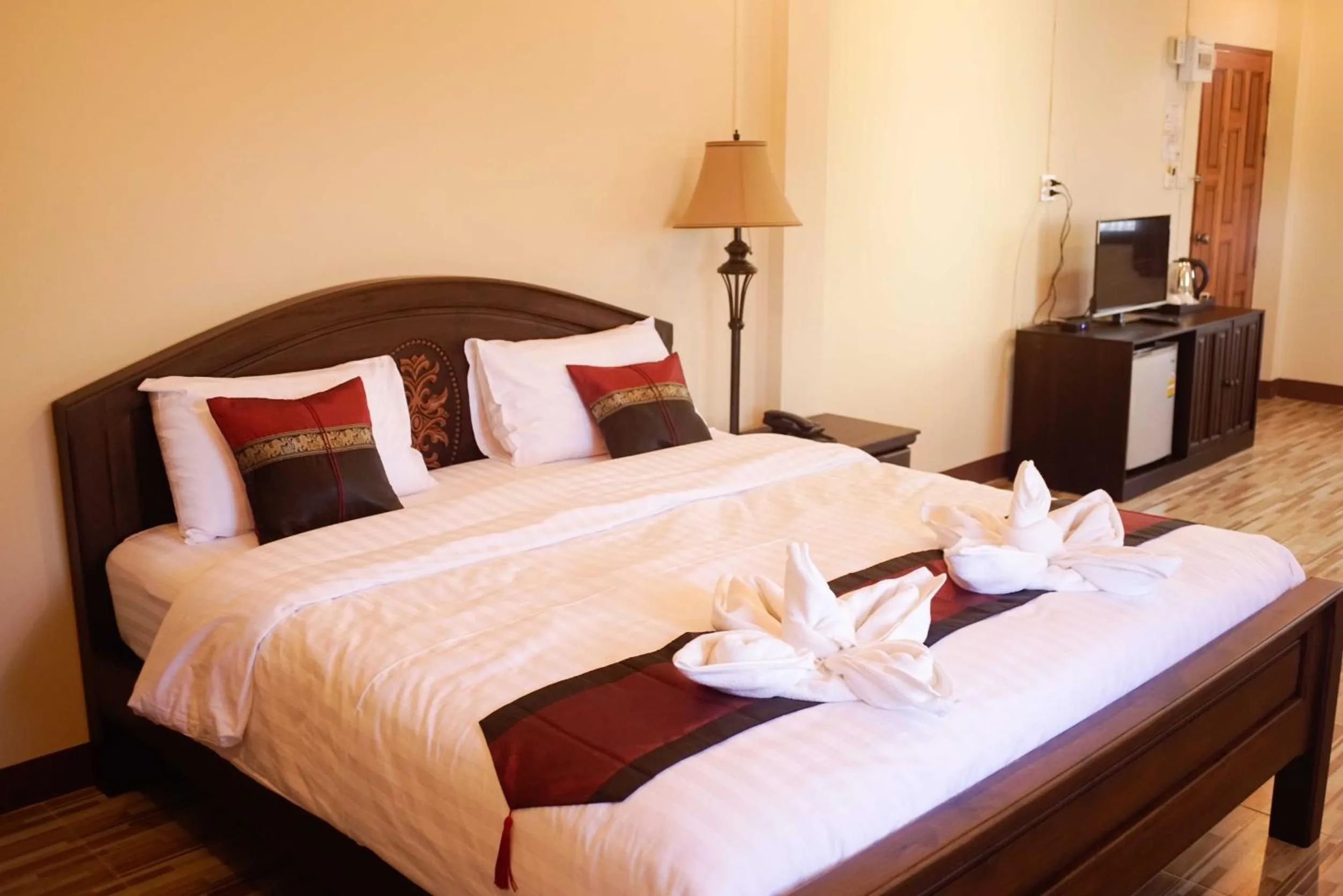 Bed in NanBaanKhun Hotel