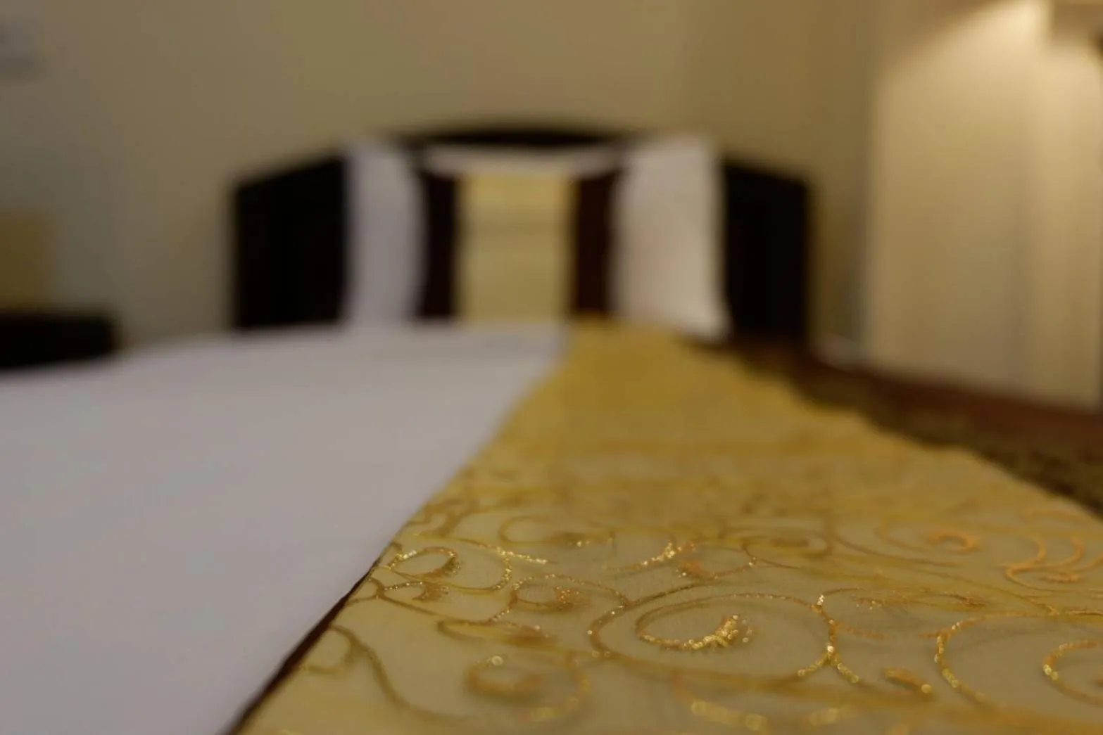 Bed in NanBaanKhun Hotel