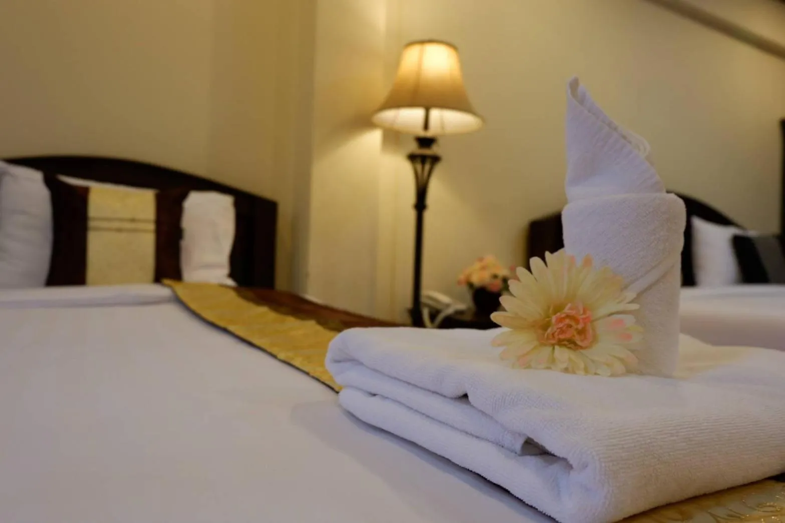 Bed in NanBaanKhun Hotel