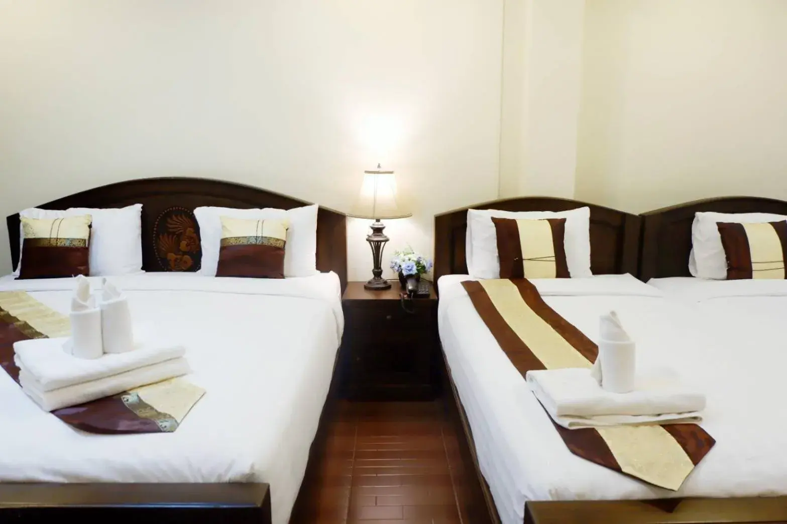 Bed in NanBaanKhun Hotel Bed in NanBaanKhun Hotel