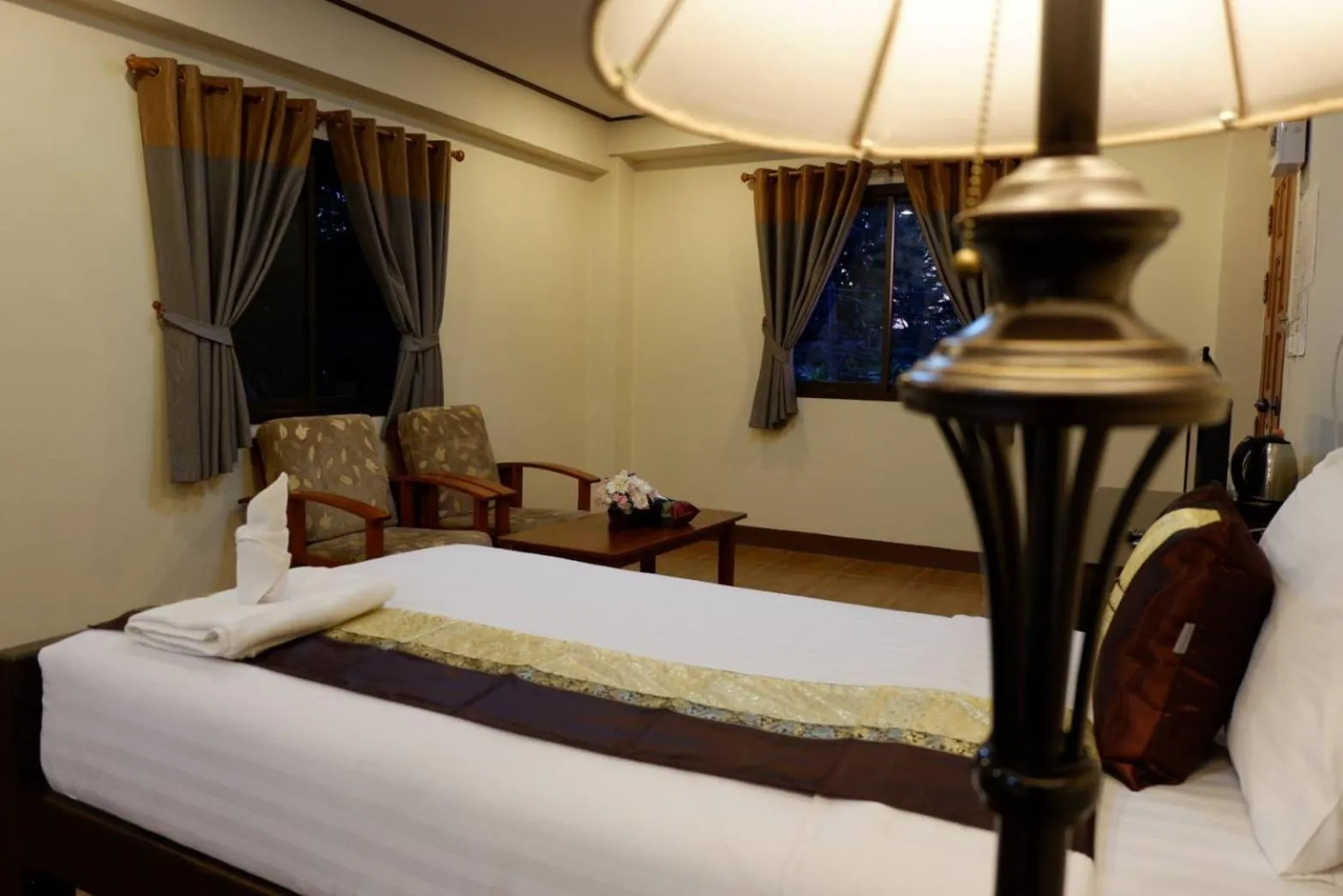 Bed in NanBaanKhun Hotel