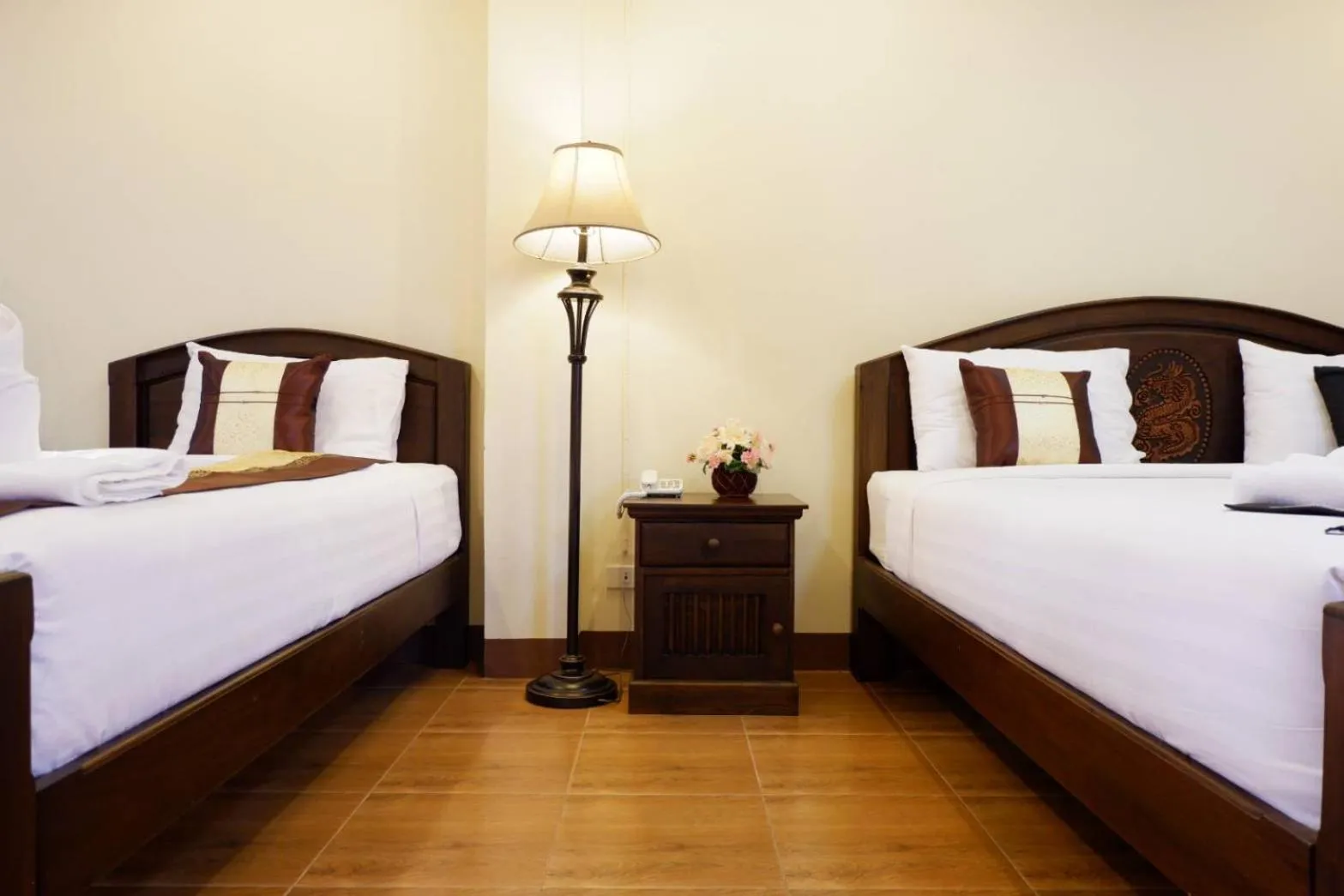 Bed in NanBaanKhun Hotel