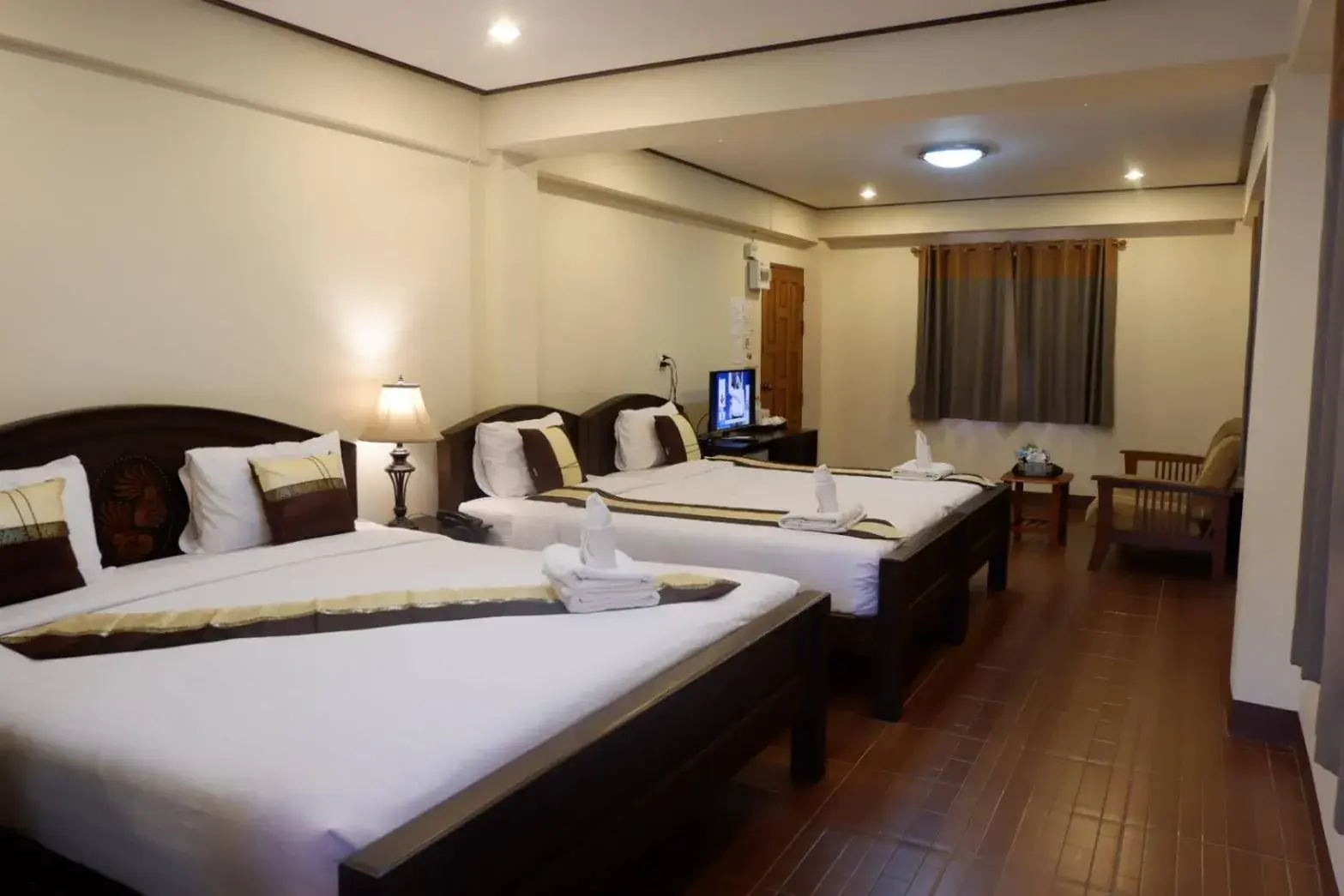 Bed in NanBaanKhun Hotel Bed in NanBaanKhun Hotel