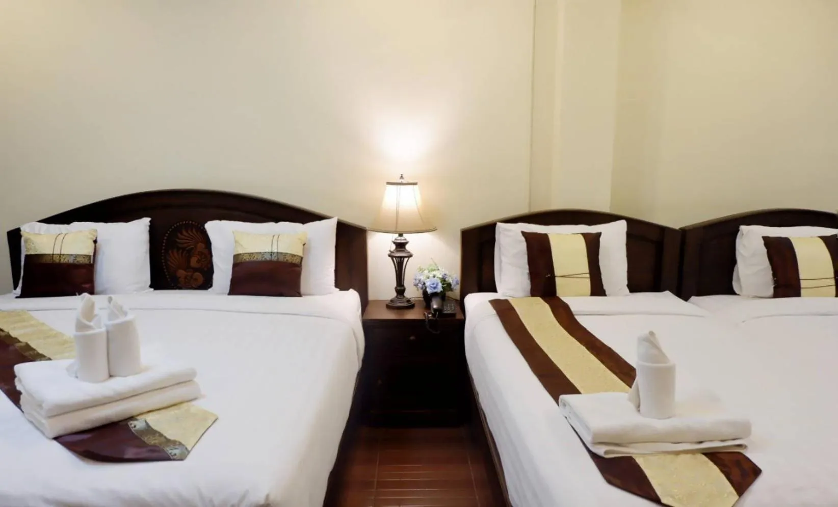 Bed in NanBaanKhun Hotel