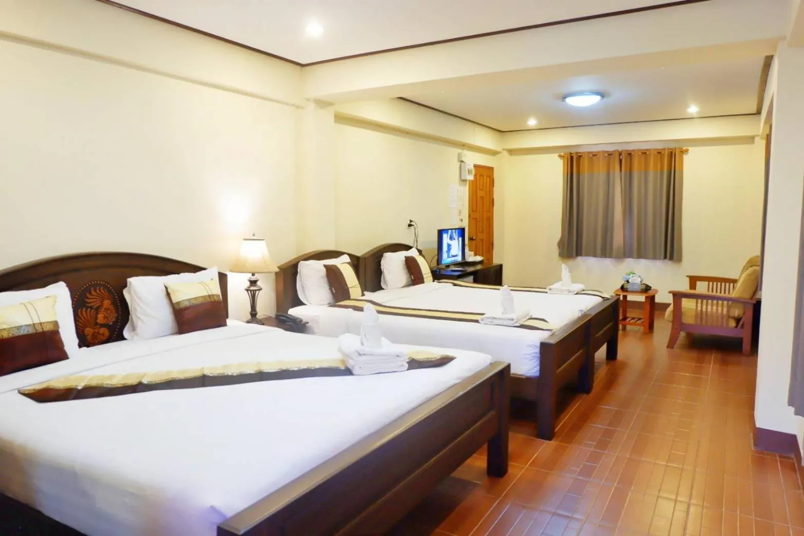 Bed in NanBaanKhun Hotel