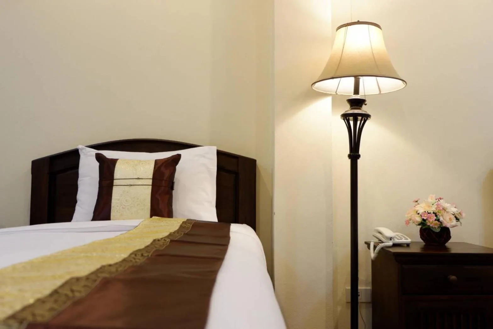 Bed in NanBaanKhun Hotel