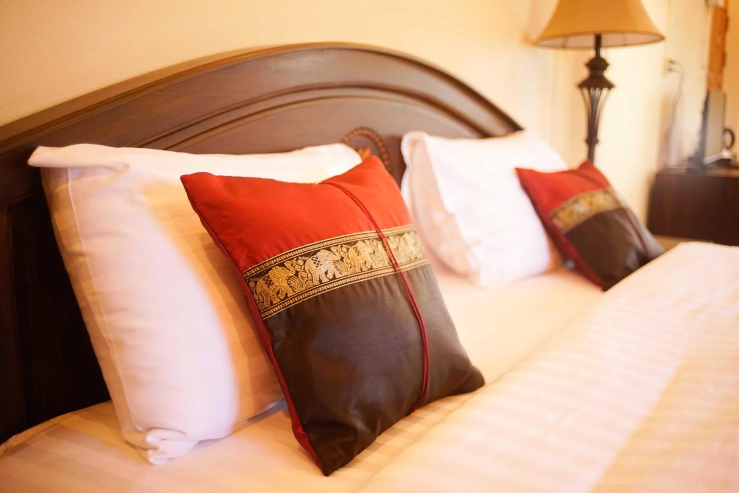 Bed in NanBaanKhun Hotel