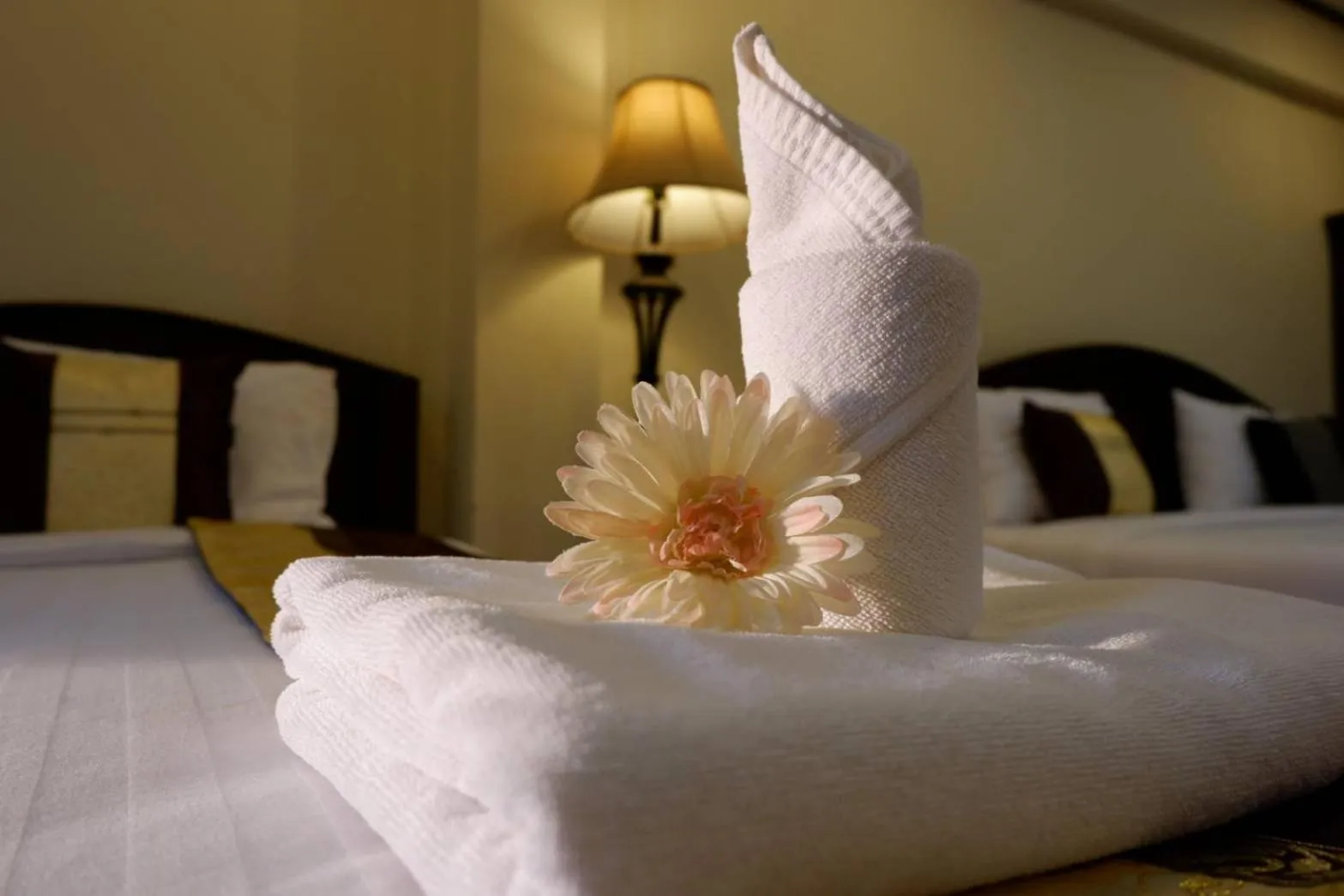 Bed in NanBaanKhun Hotel